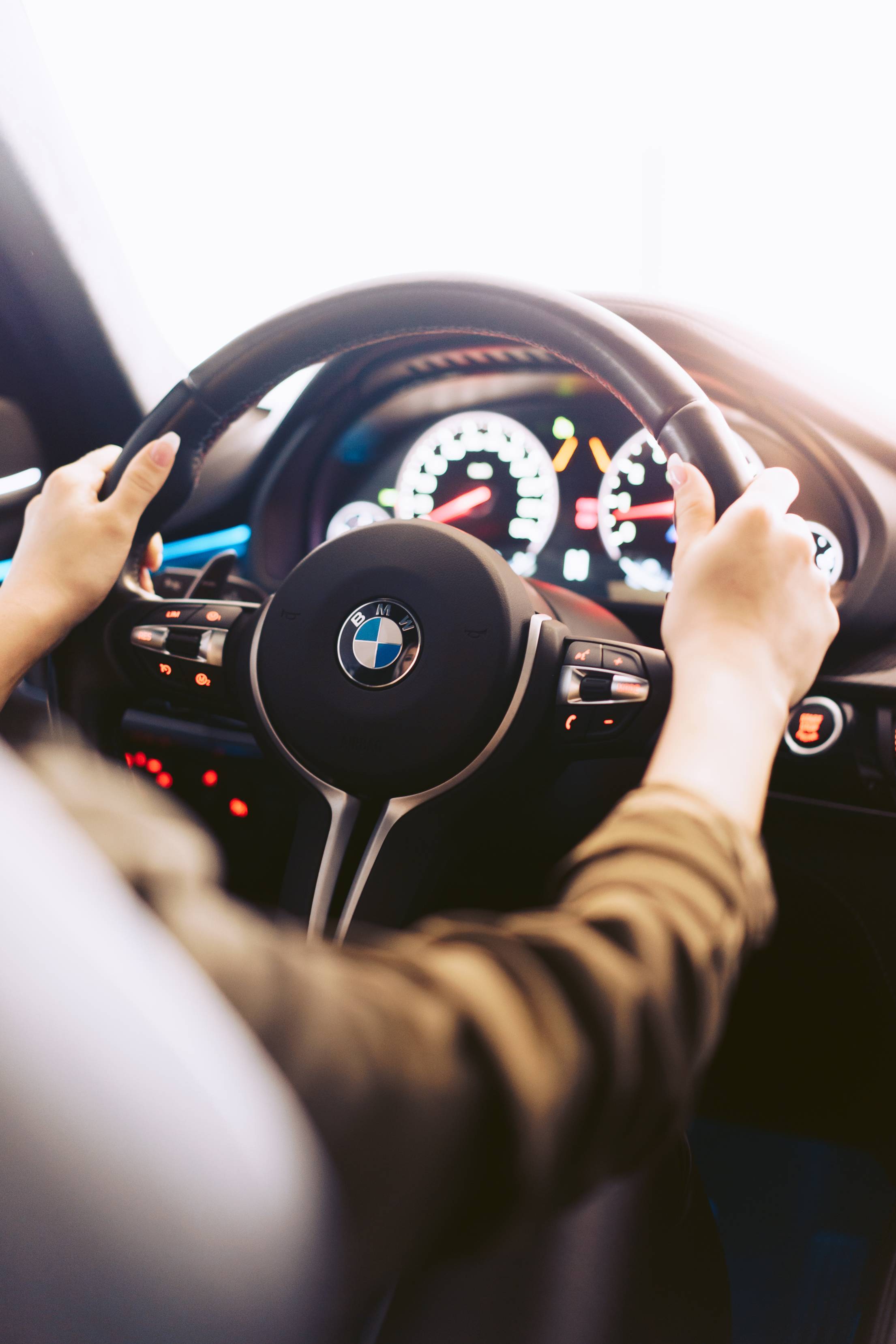 Woman Driving a Luxury Car Vertical