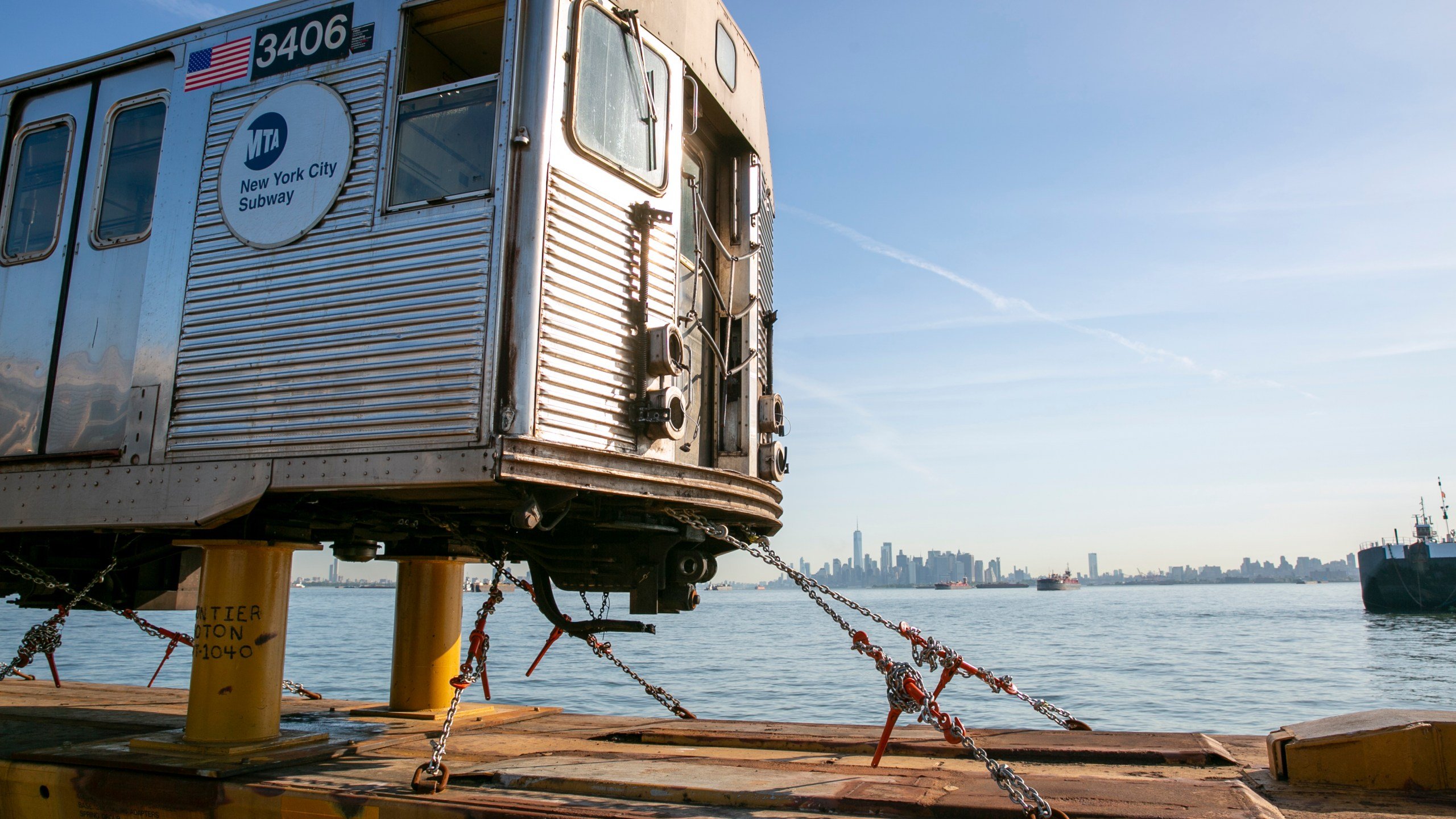Bon voyage: Old subway cars float off