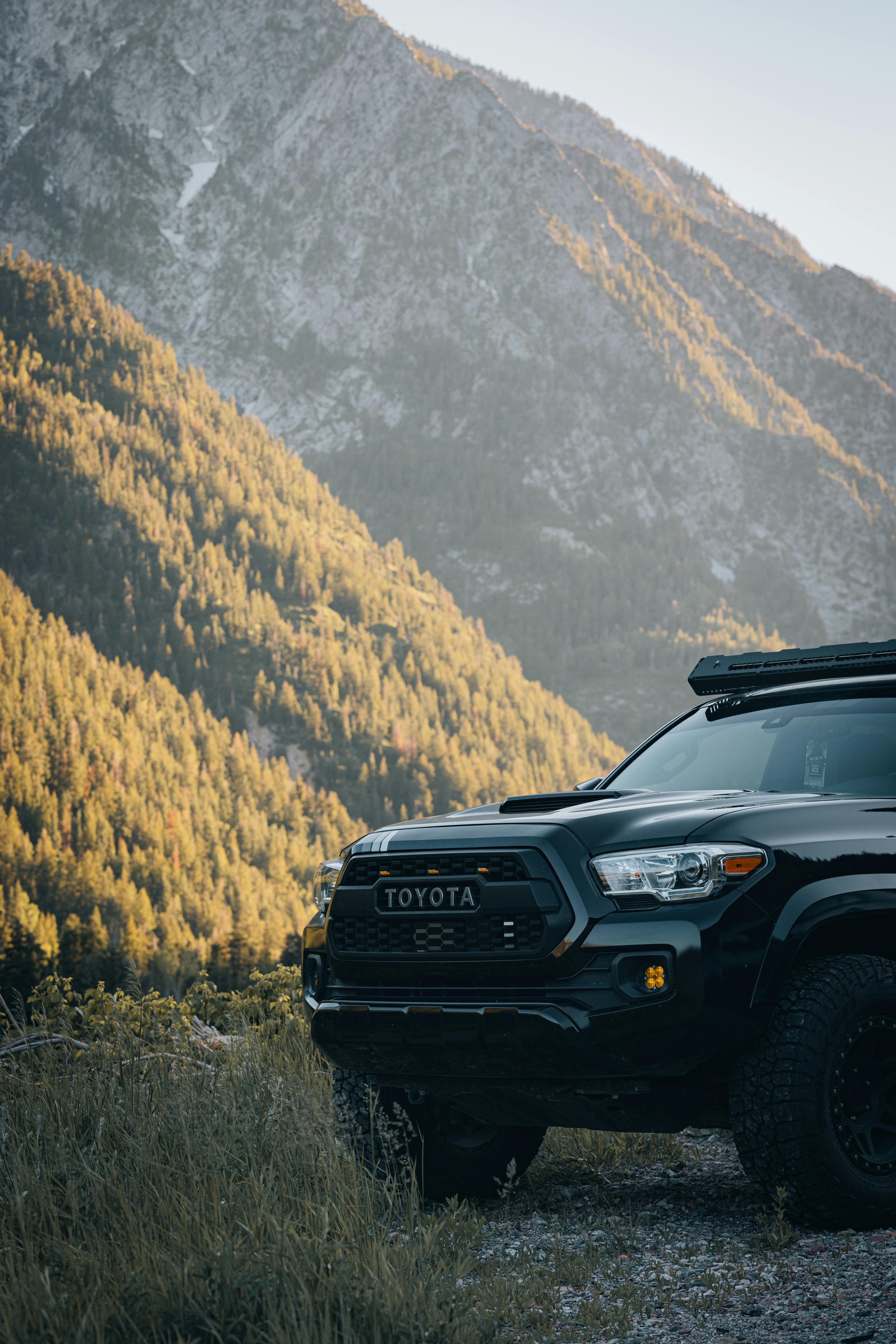 Black Toyota Tacoma in Mountains · Free