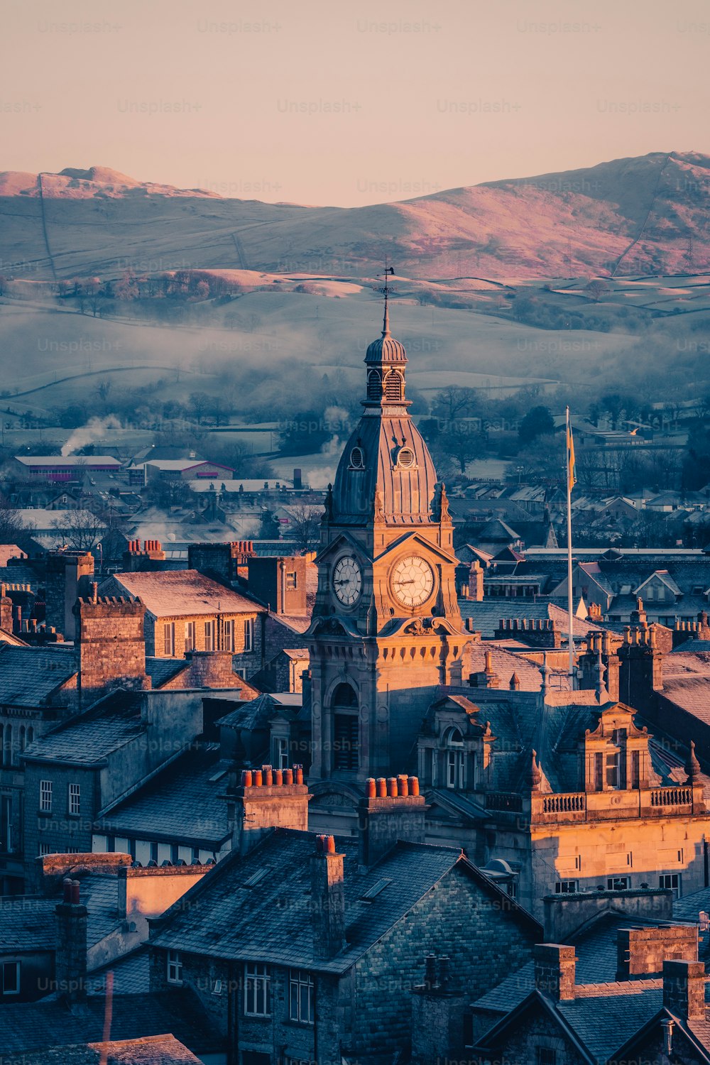 large clock tower towering over a city