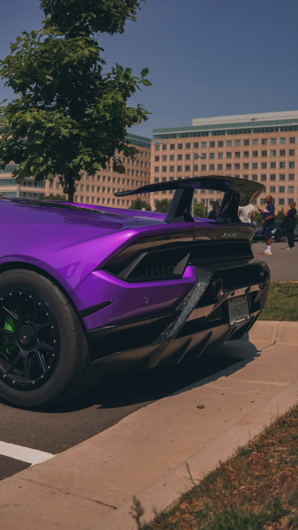 A purple sports car parked in a parking
