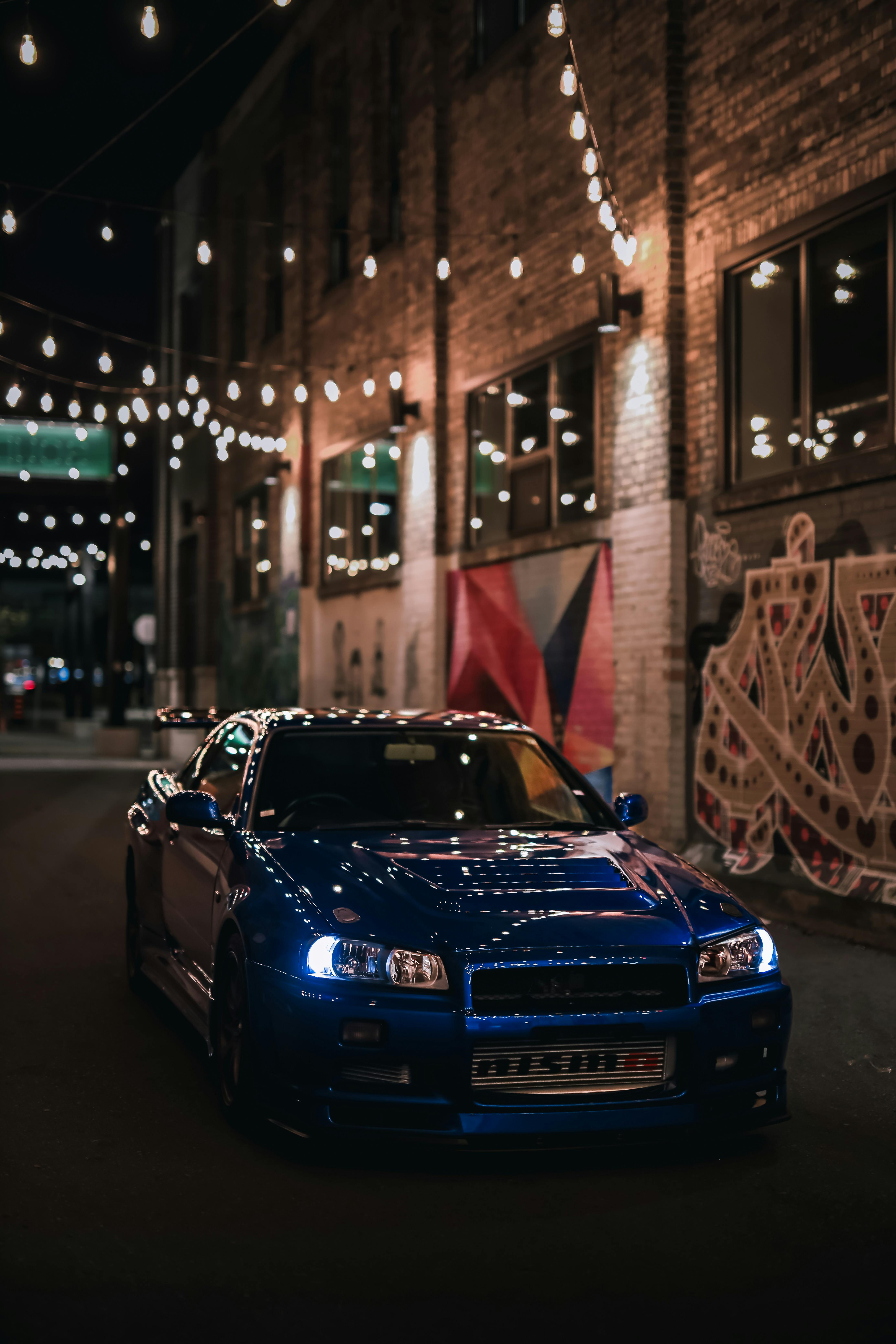 Blue Nissan Skyline R34 GTR at Night