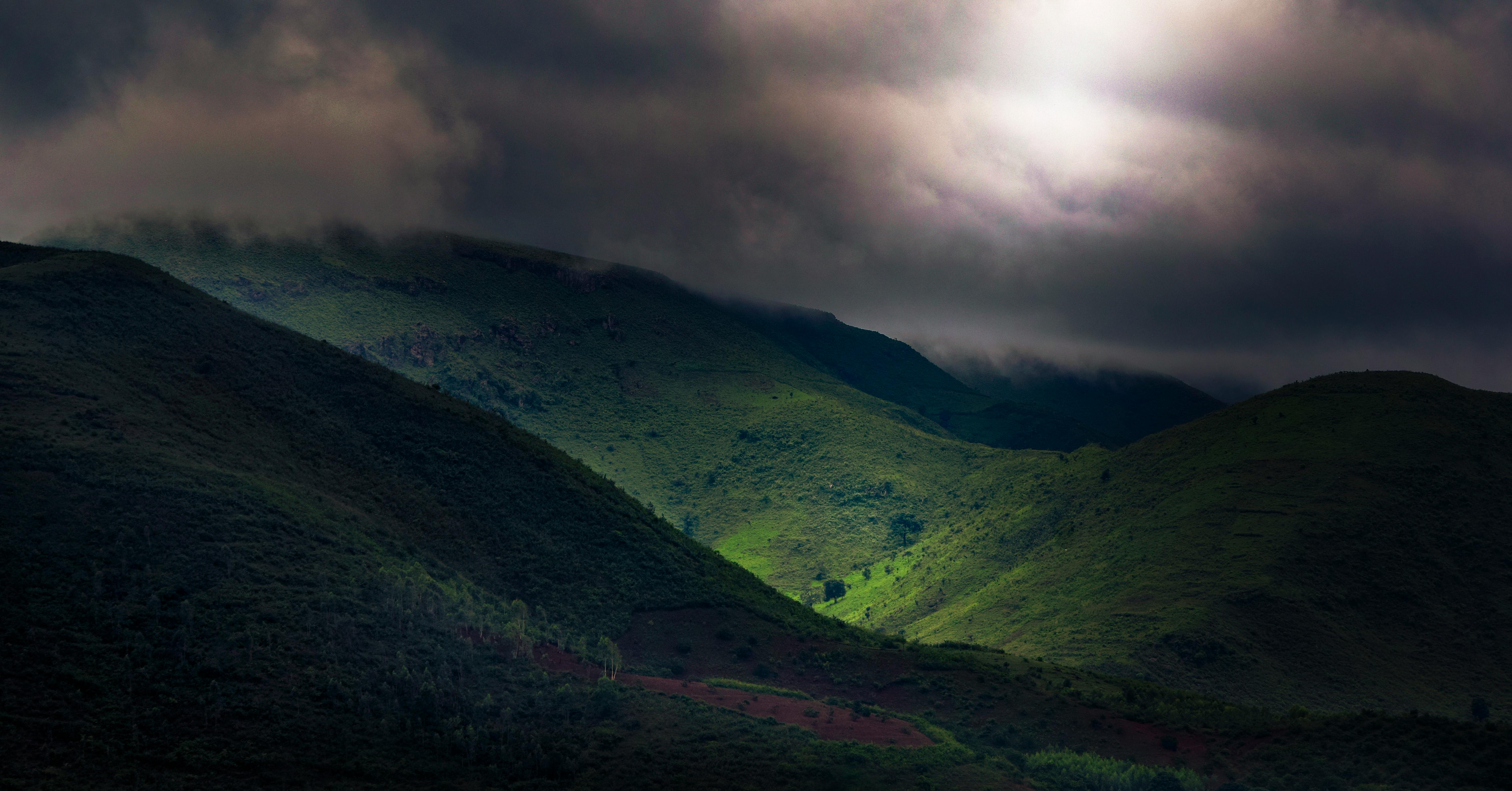 Green Mountains Under Dark Sky · Free