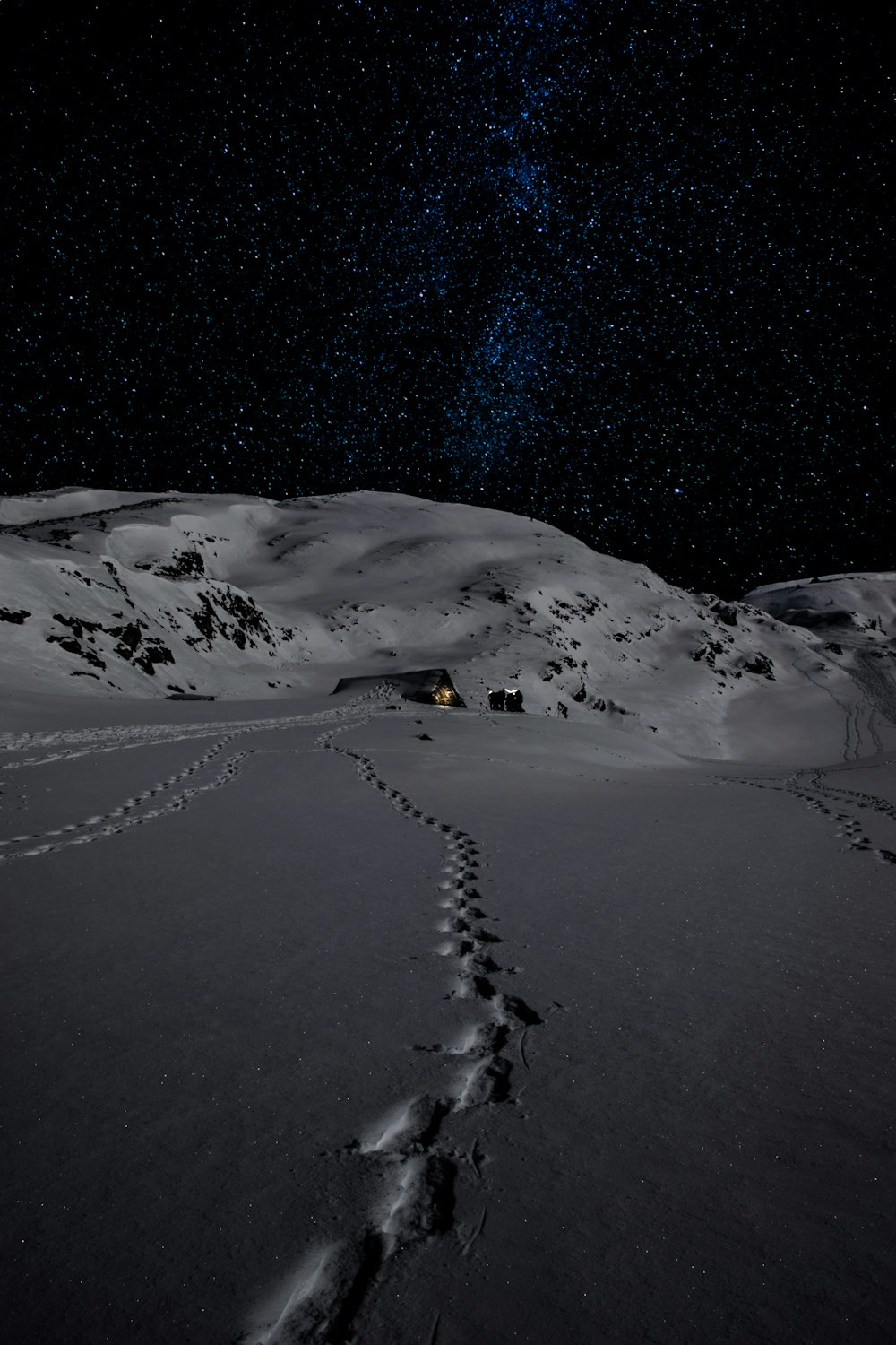 House on mountain in snow photo