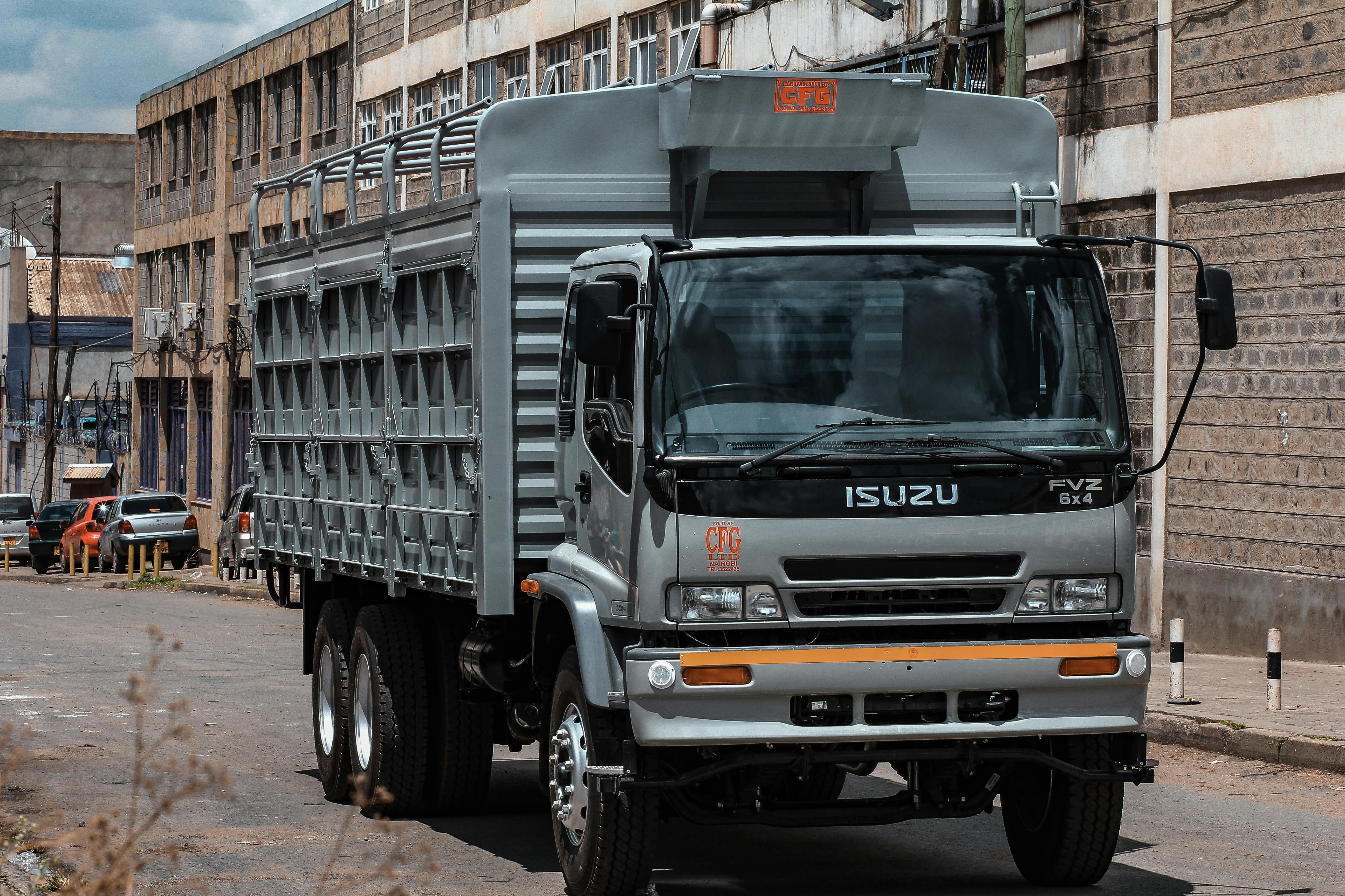 Gray Isuzu Truck on Road · Free