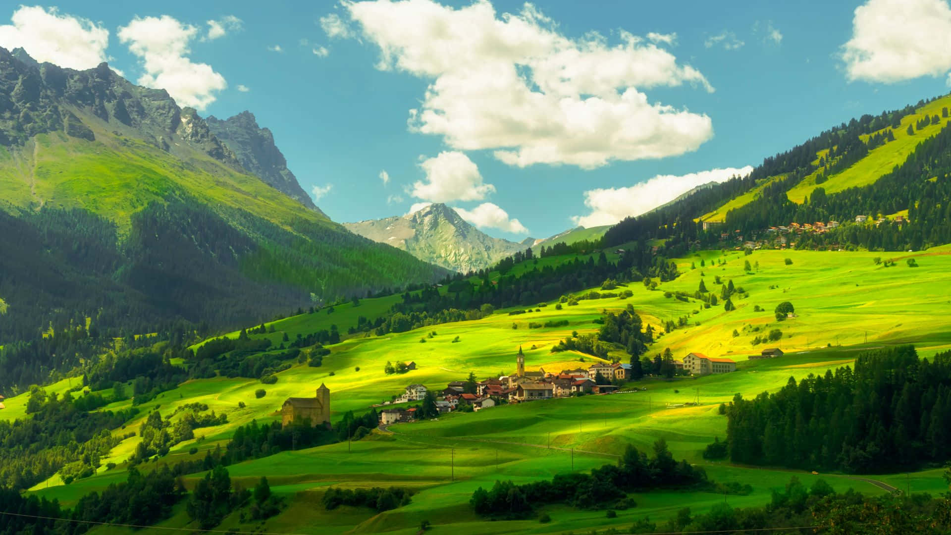 Download Majestic Swiss Alps overlooking a tranquil village