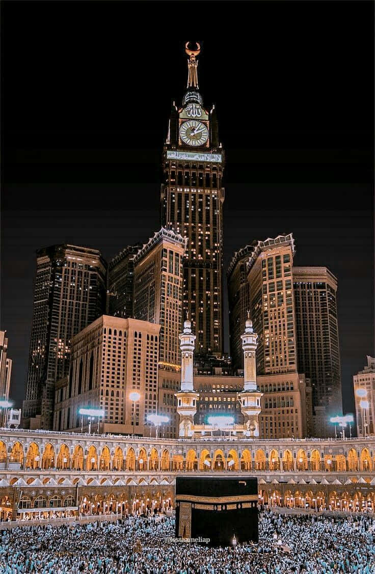 A Clock Tower And A Kaaba