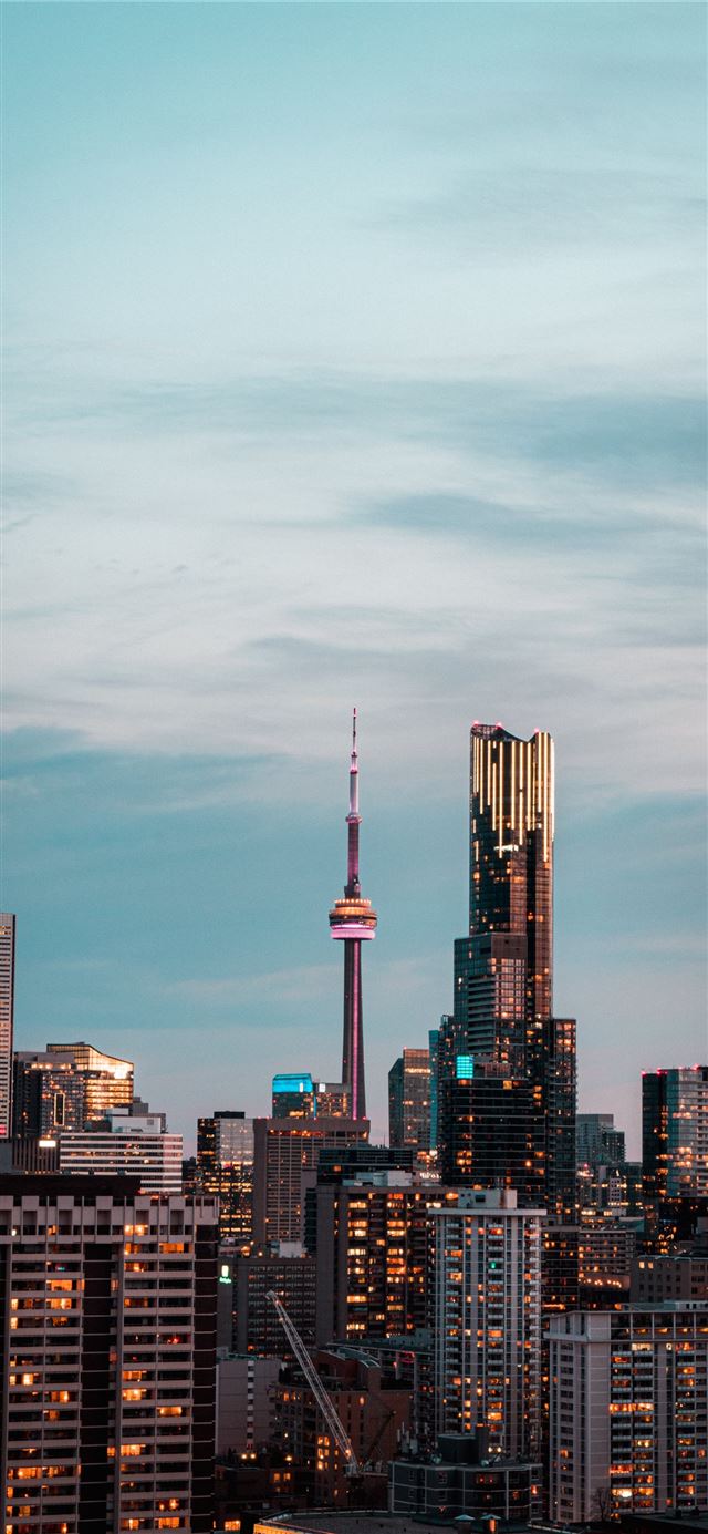 city skyline under gray cloudy sky
