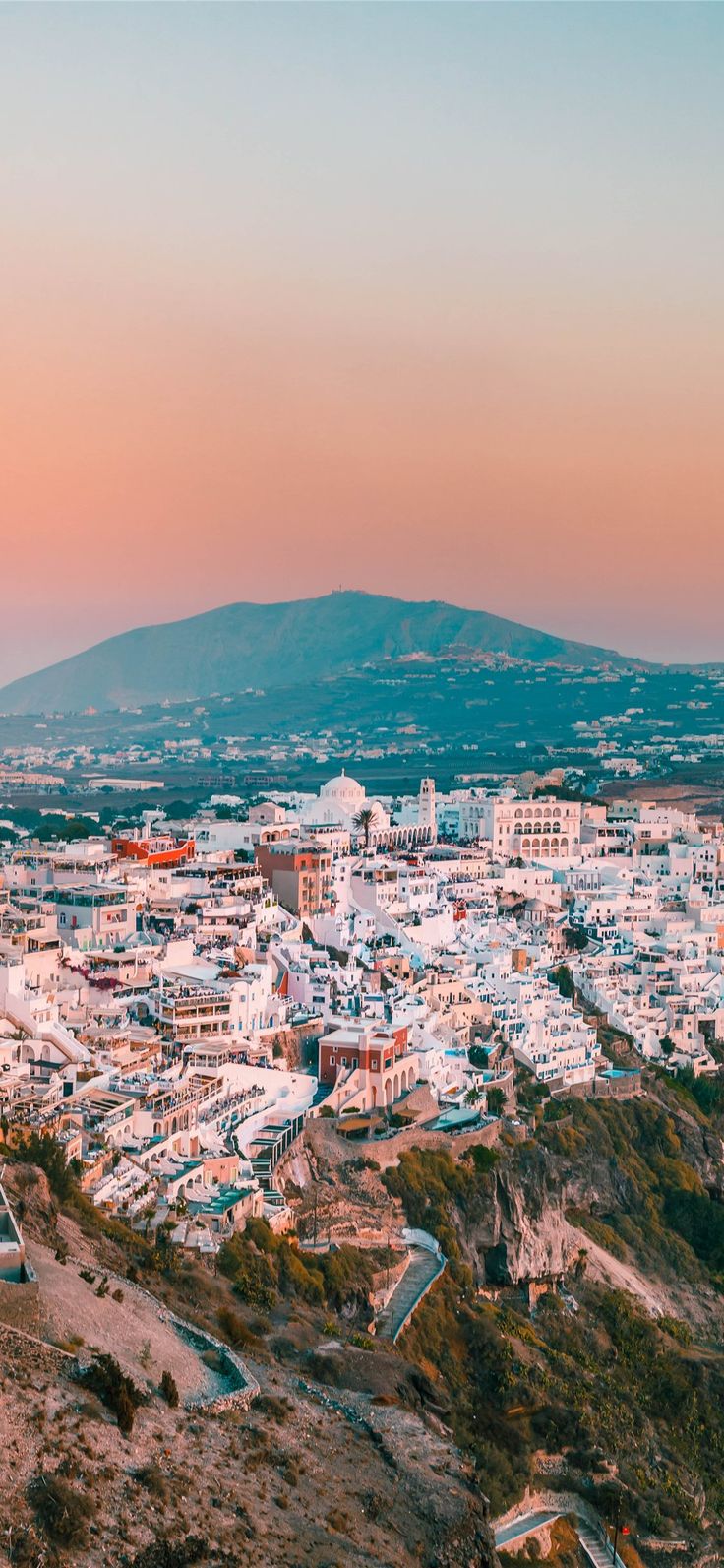 city buildings on mountain during