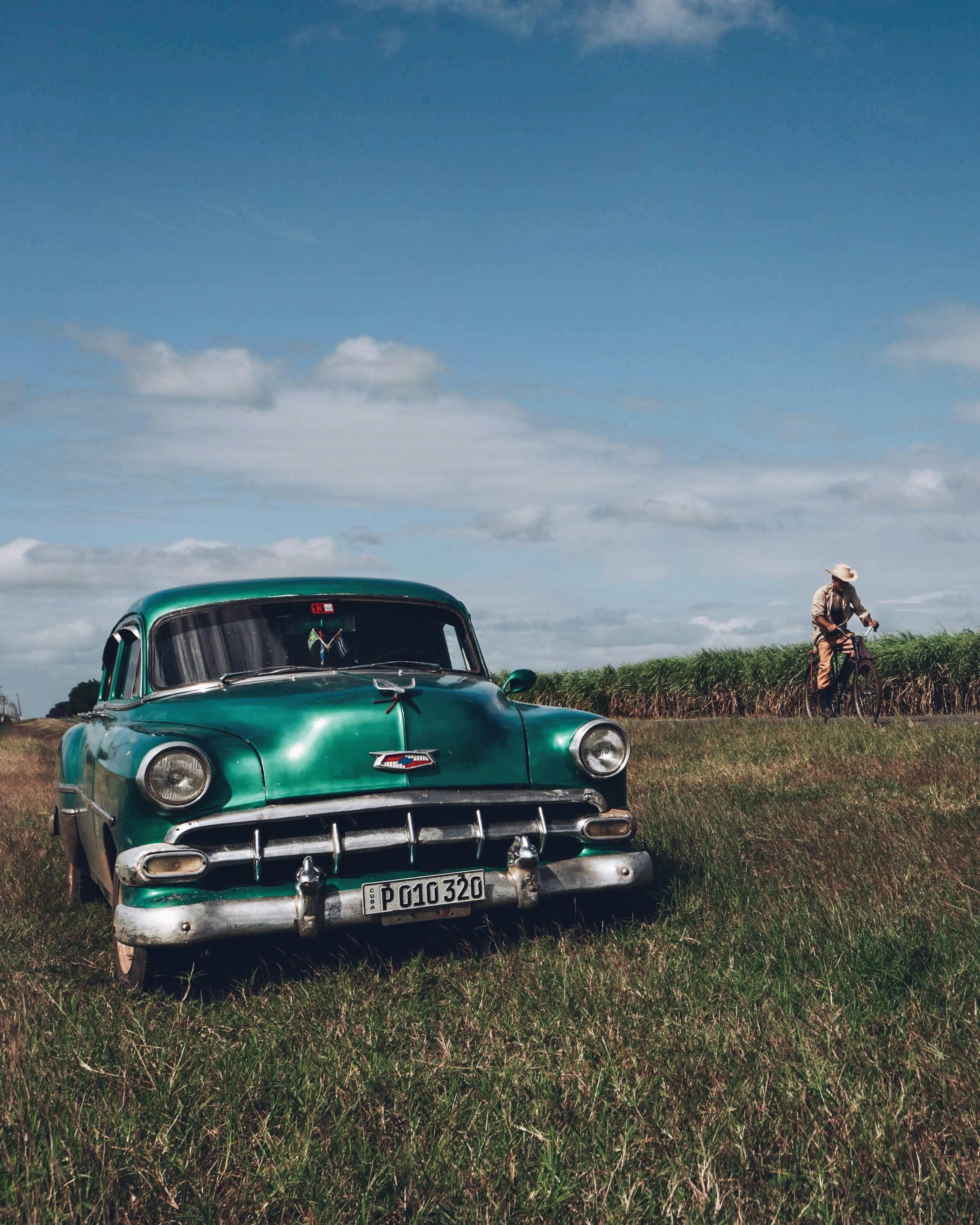 Green Vintage Car on a Field · Free