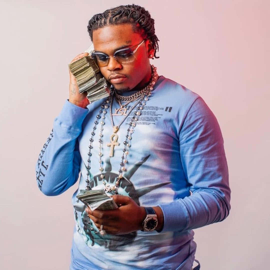 Gunna Holding Stack Of Cash Wallpaper