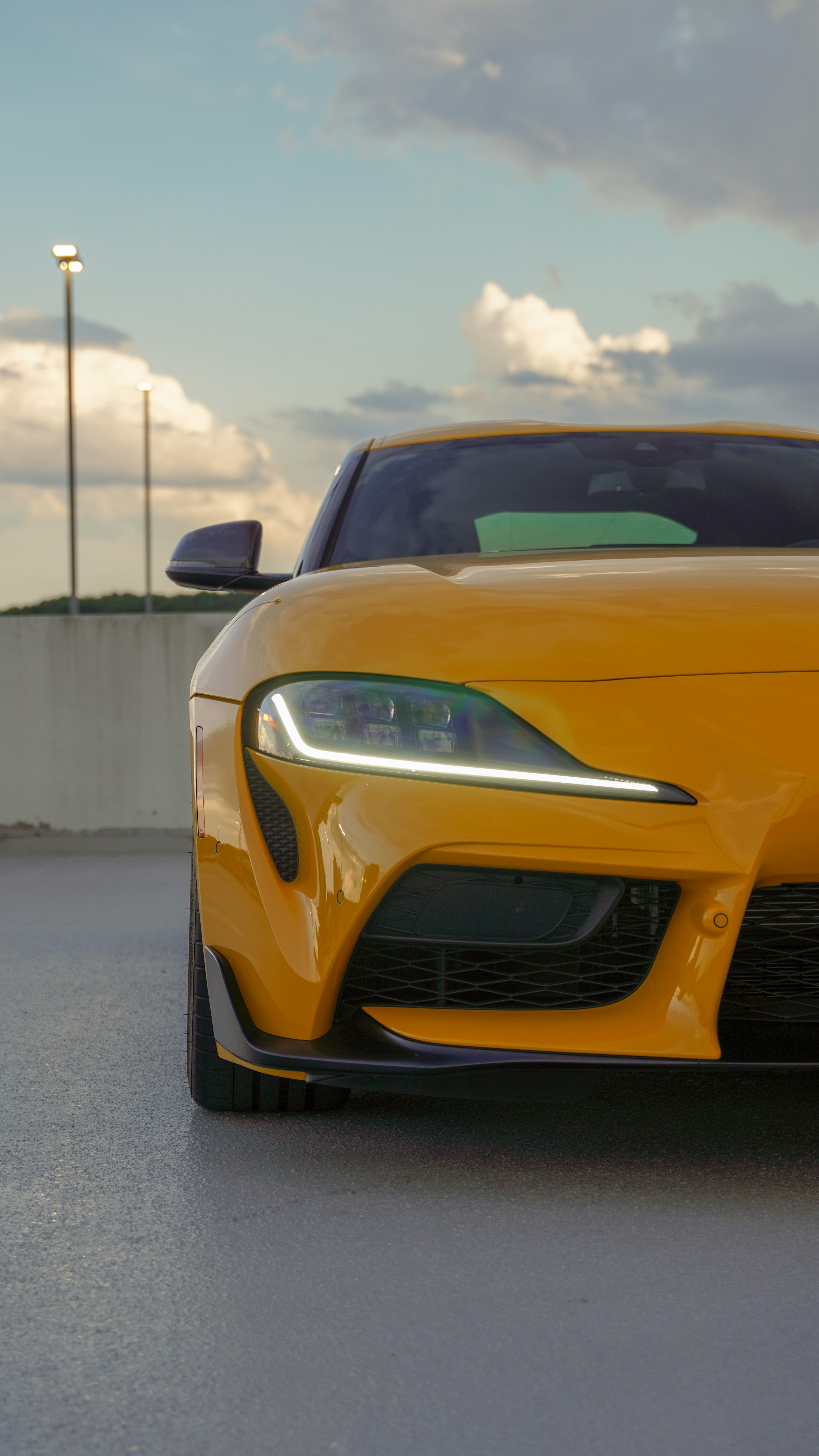 The front end of a yellow sports car