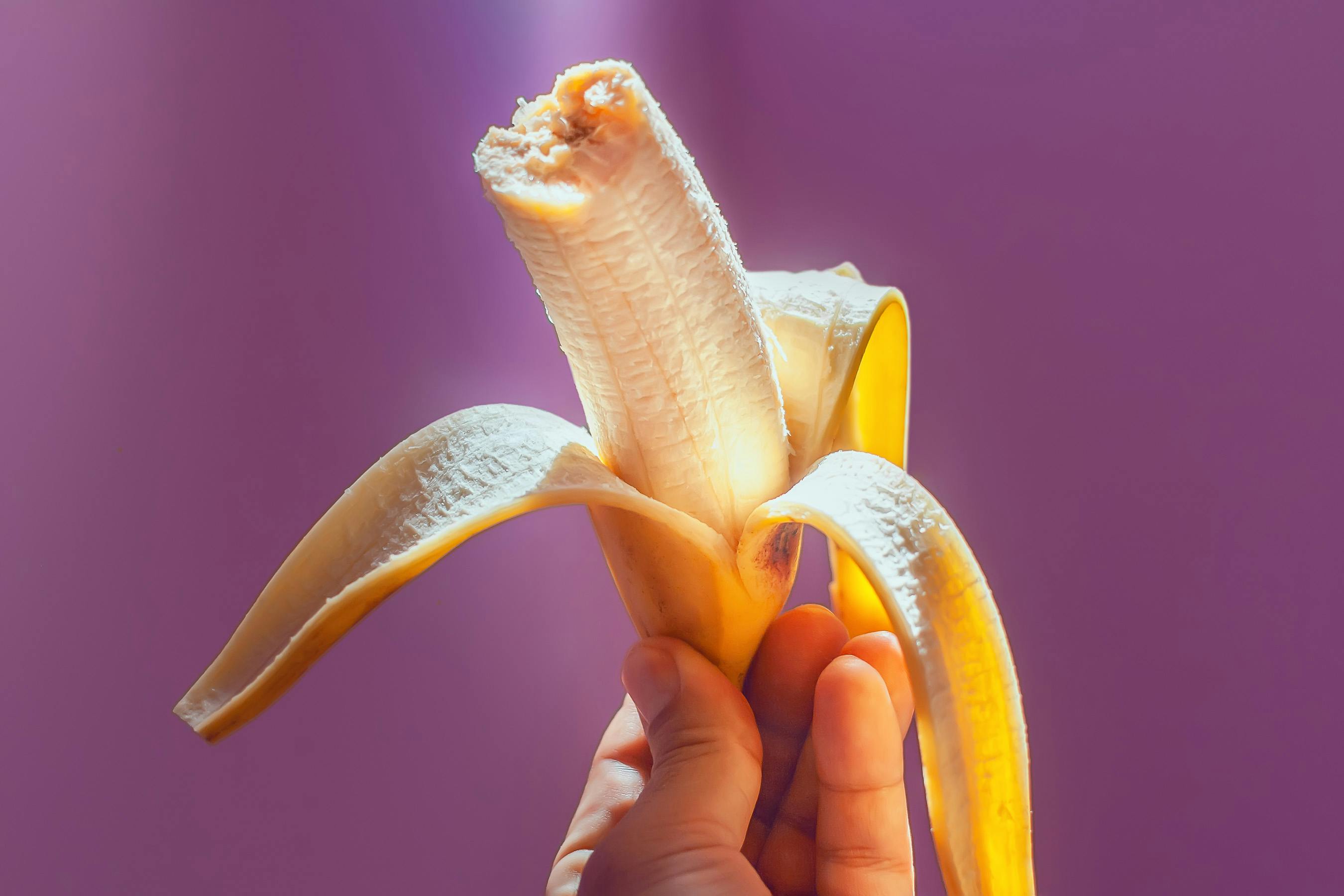 Peeled Banana in Hand · Free