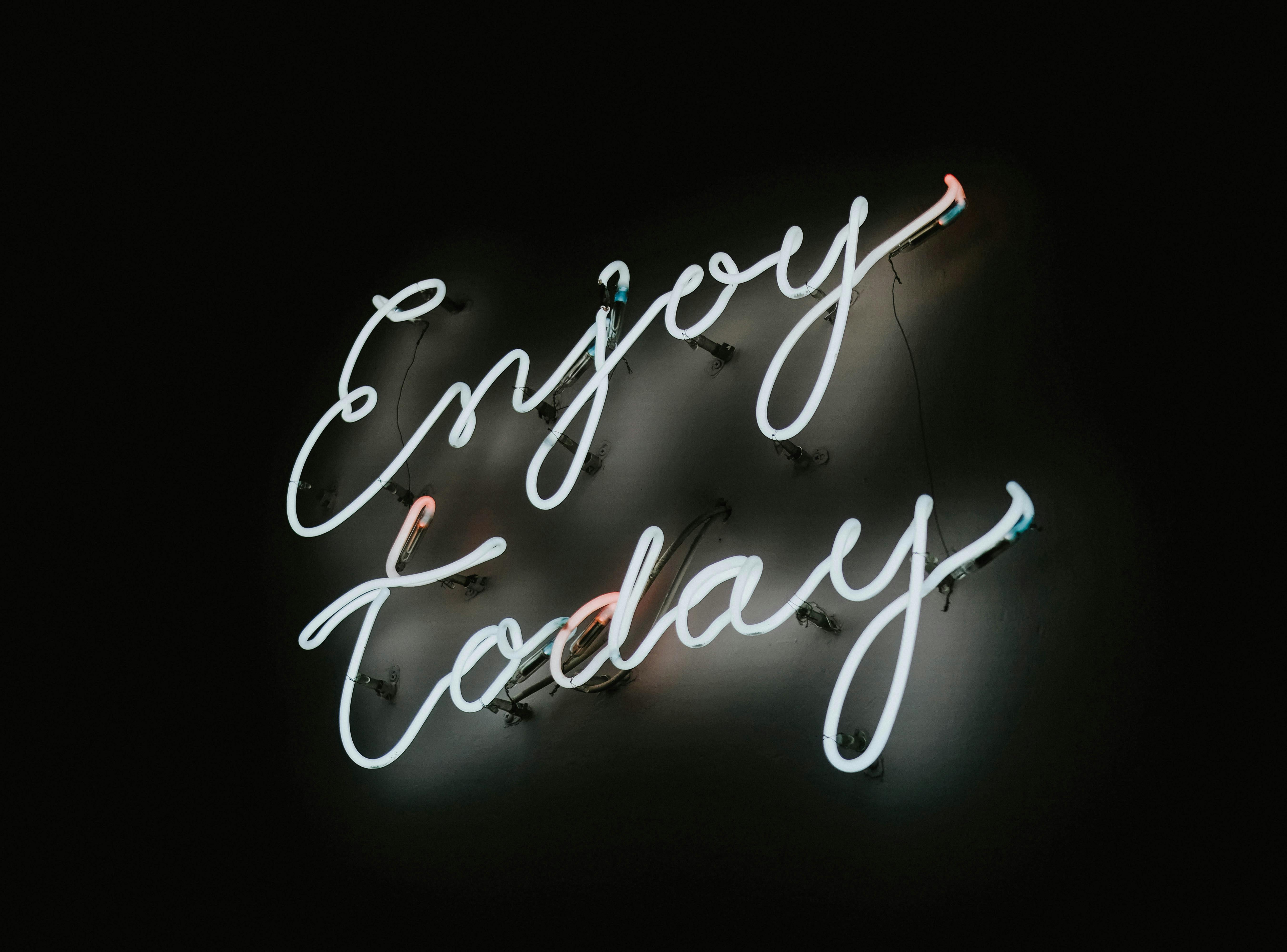 Neon Sign in a Black Background · Free