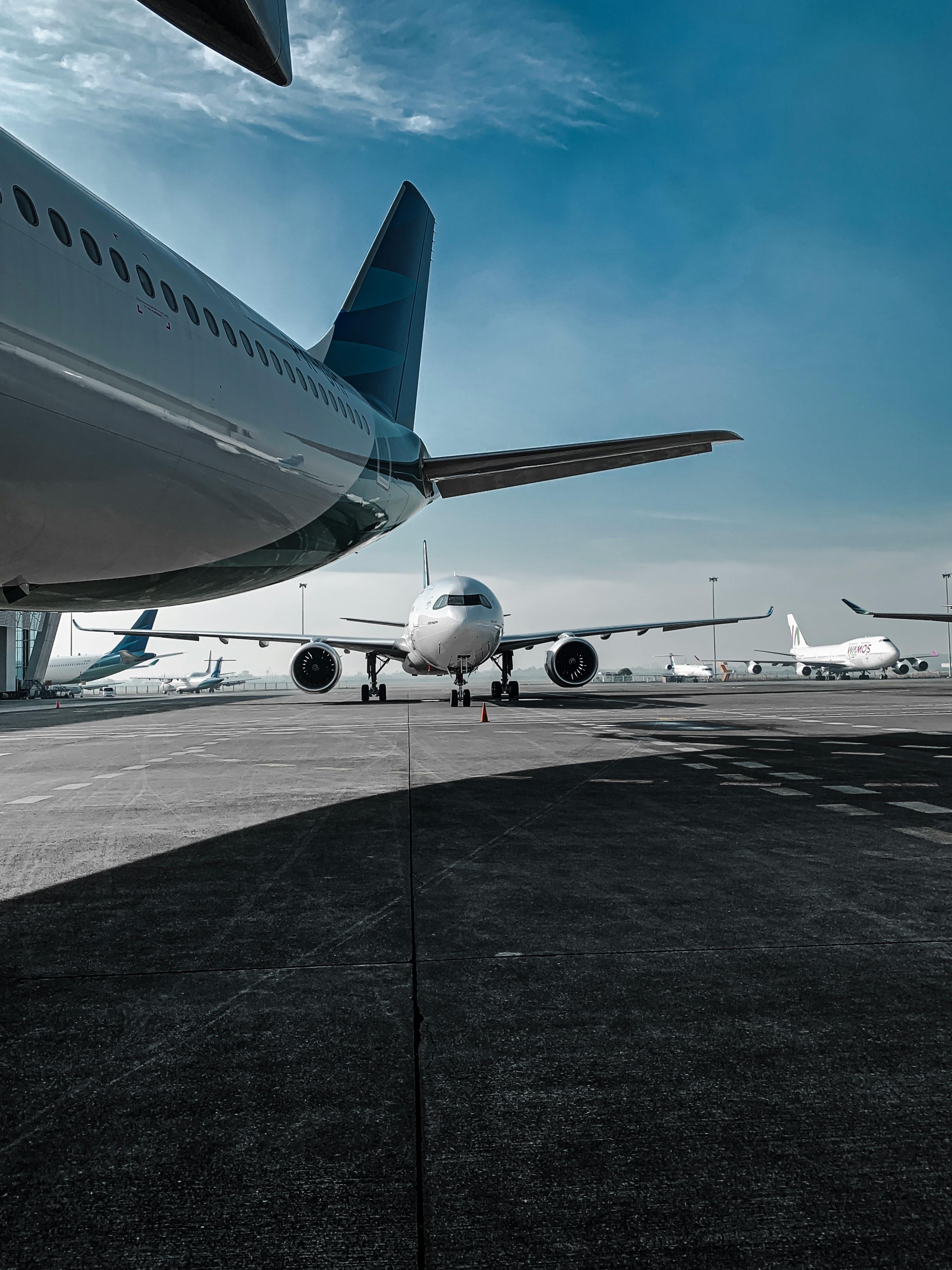 Modern aircraft on runway in airport
