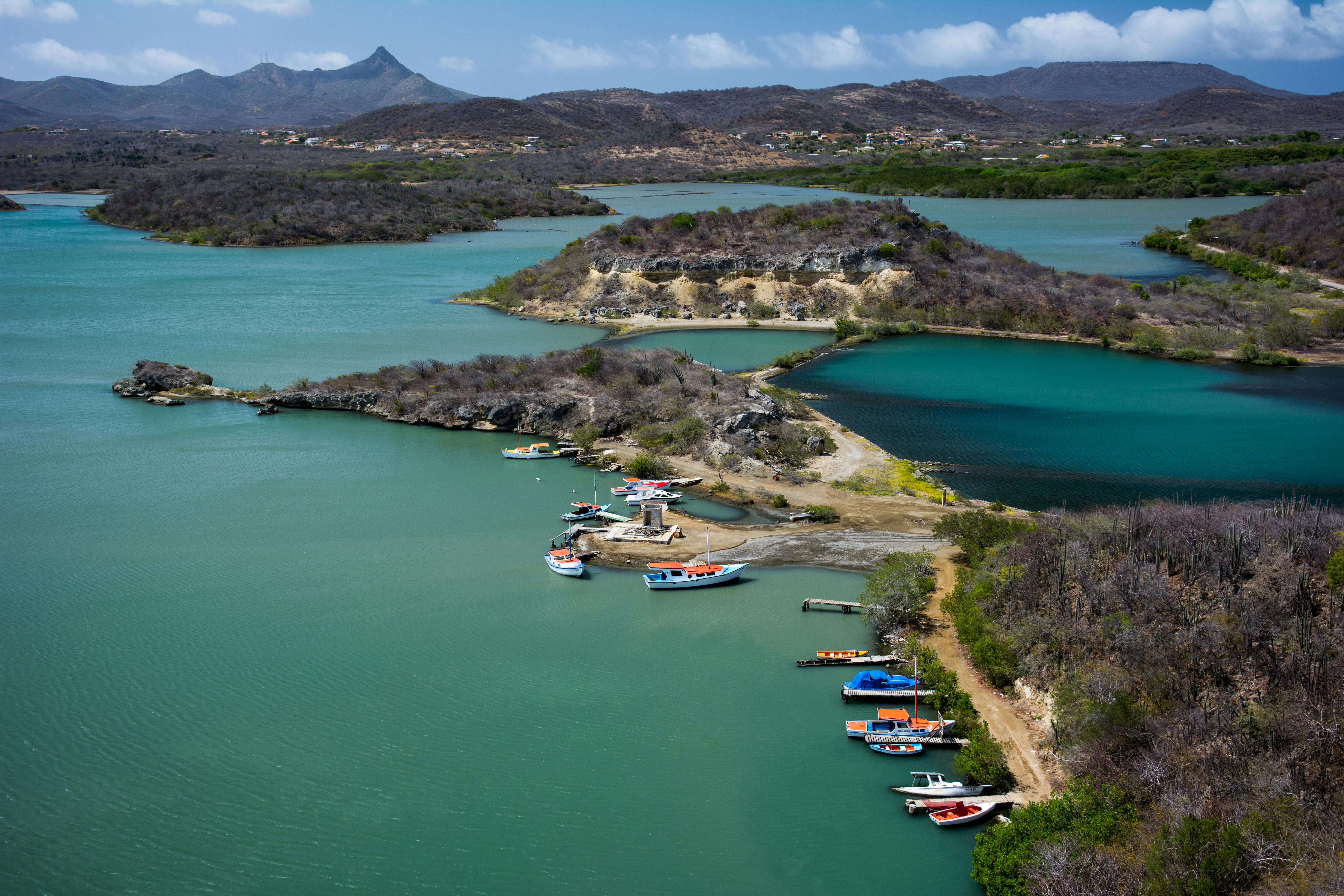 Aerial Photography of Boats Beside Road