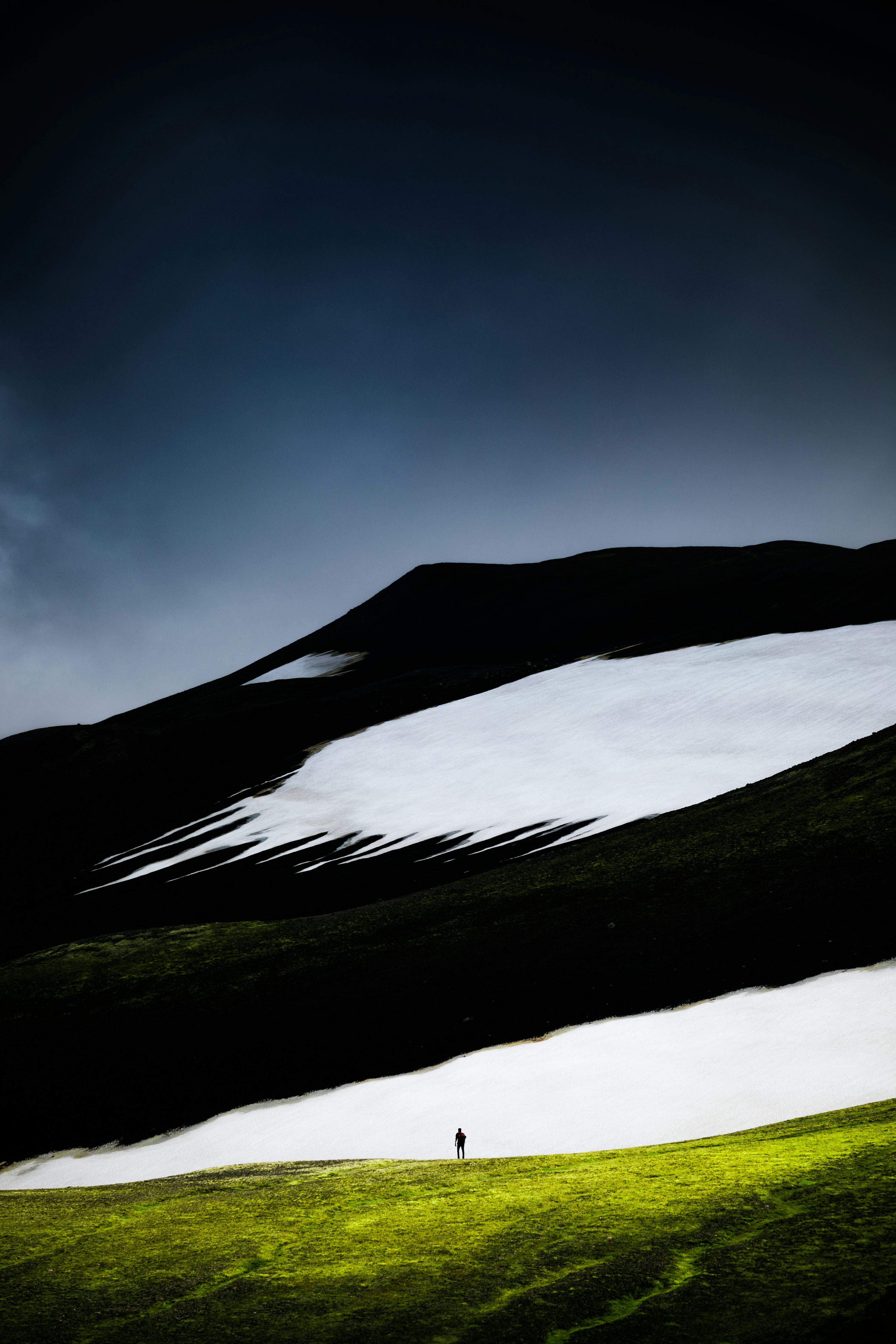 Person standing near mountain photo
