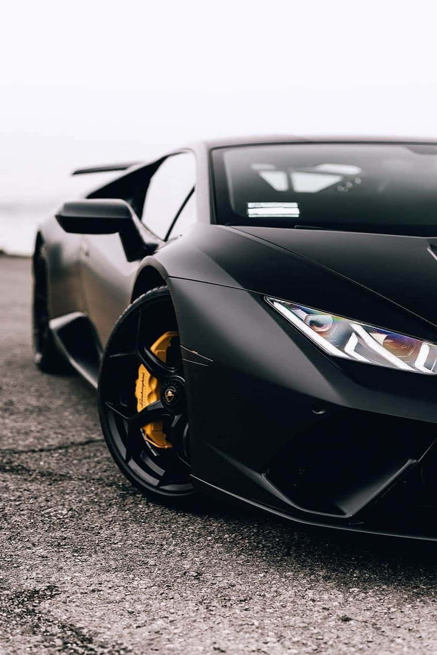 Download A Black Lamborghini Parked On