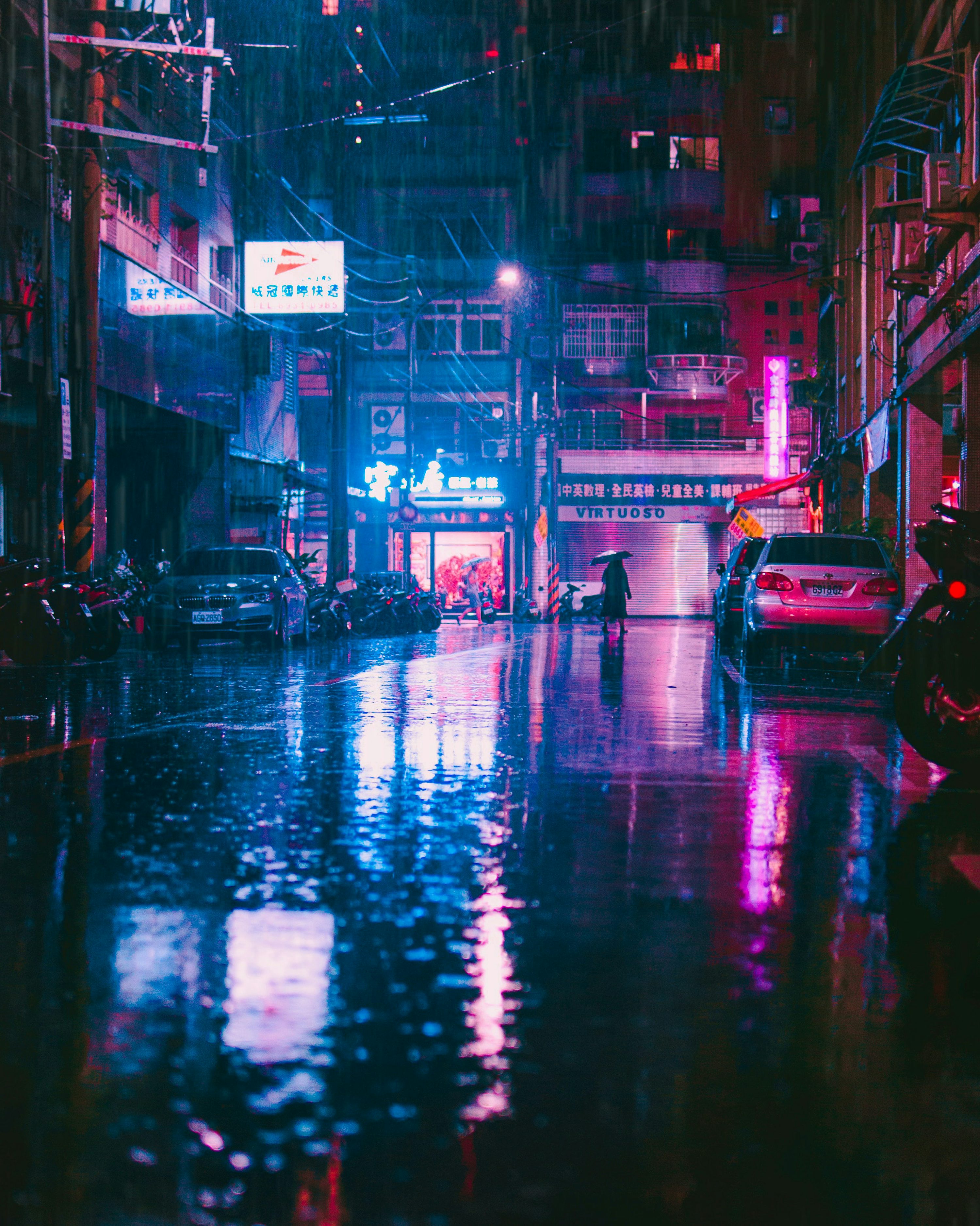 A wet street at night photo
