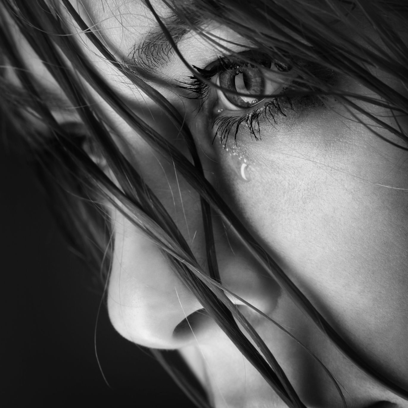 beauty girl cry on black background