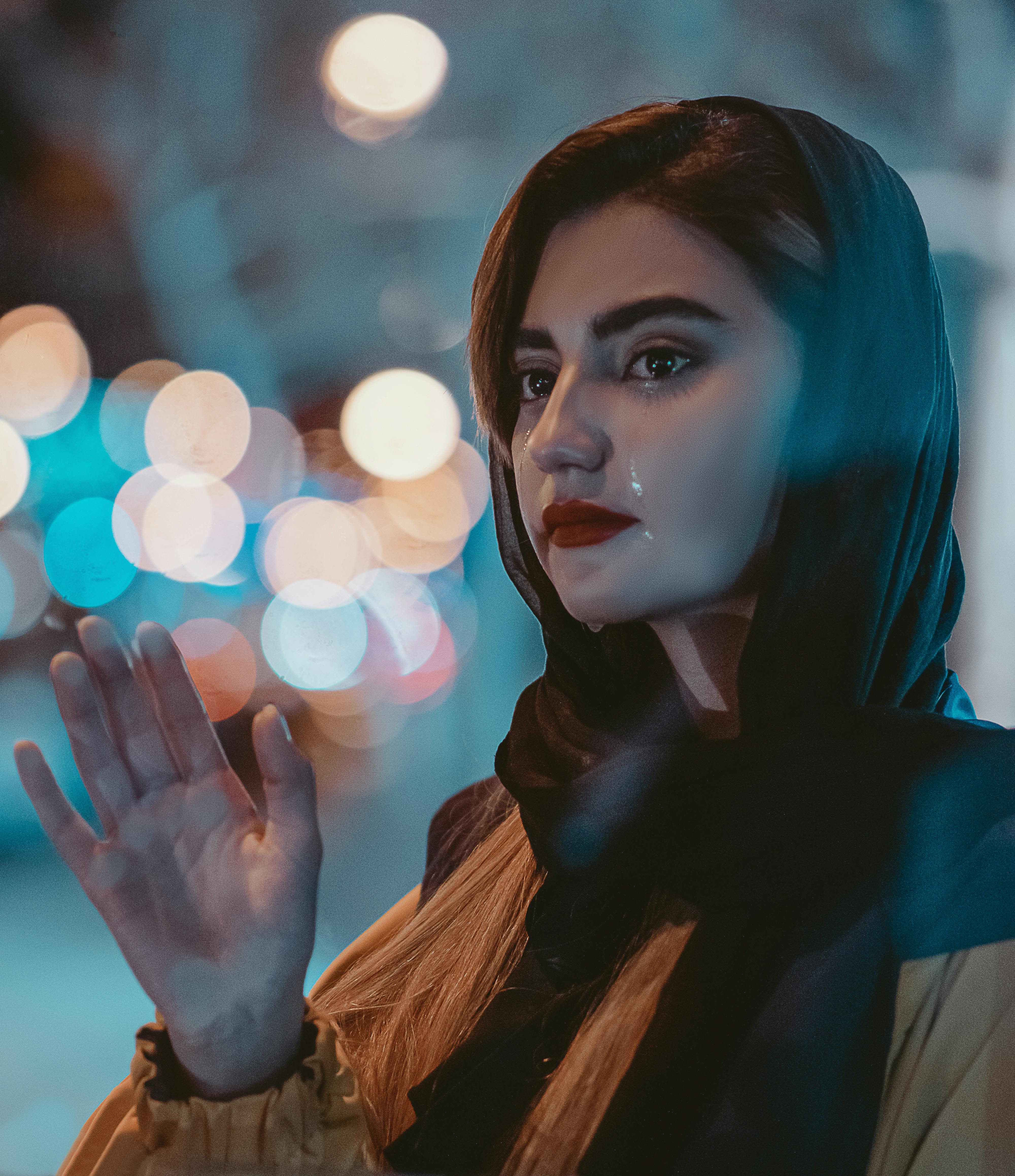 A Beautiful Woman Crying while Waving