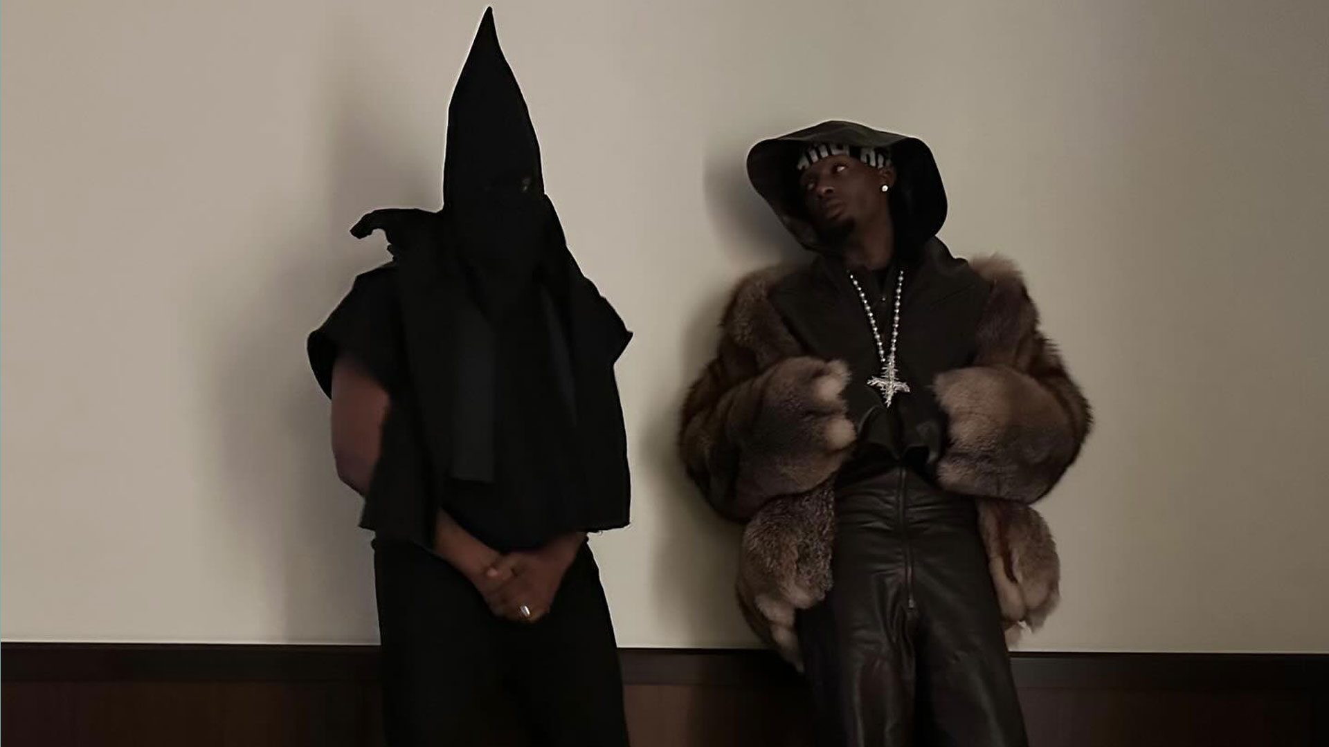 wearing black 'KKK hood