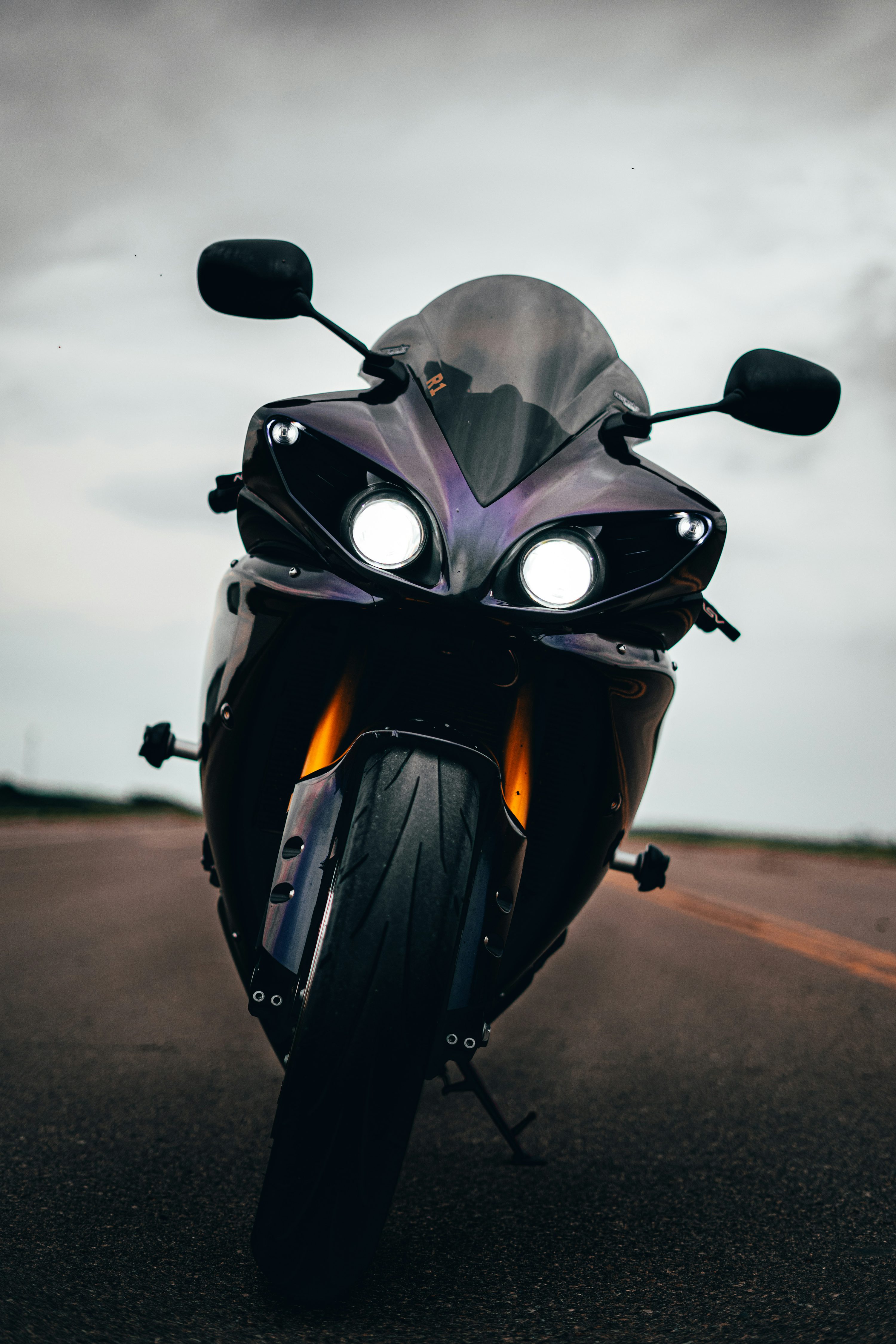 Black and gray motorcycle on road