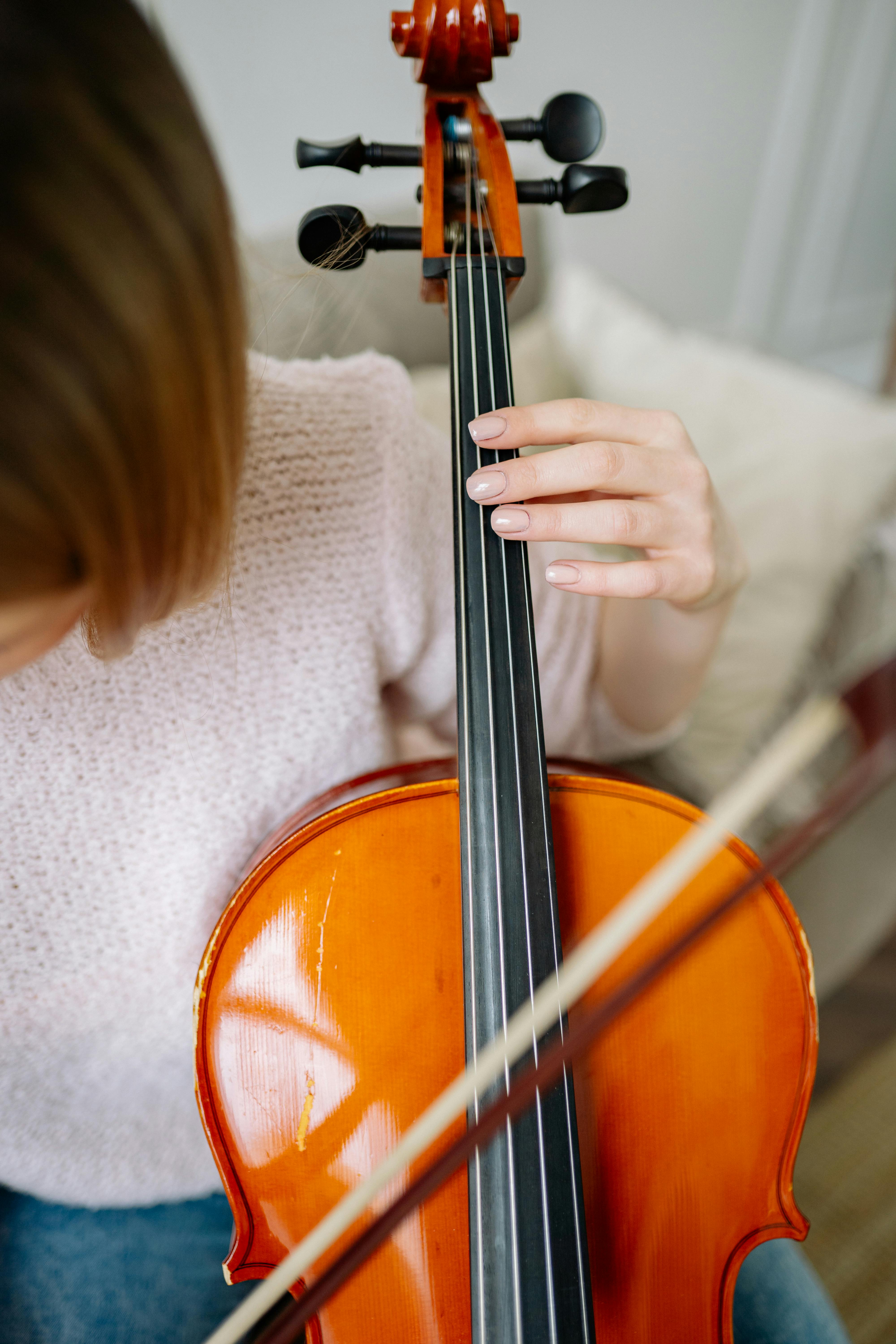 Person Playing Brown Cello · Free Stock