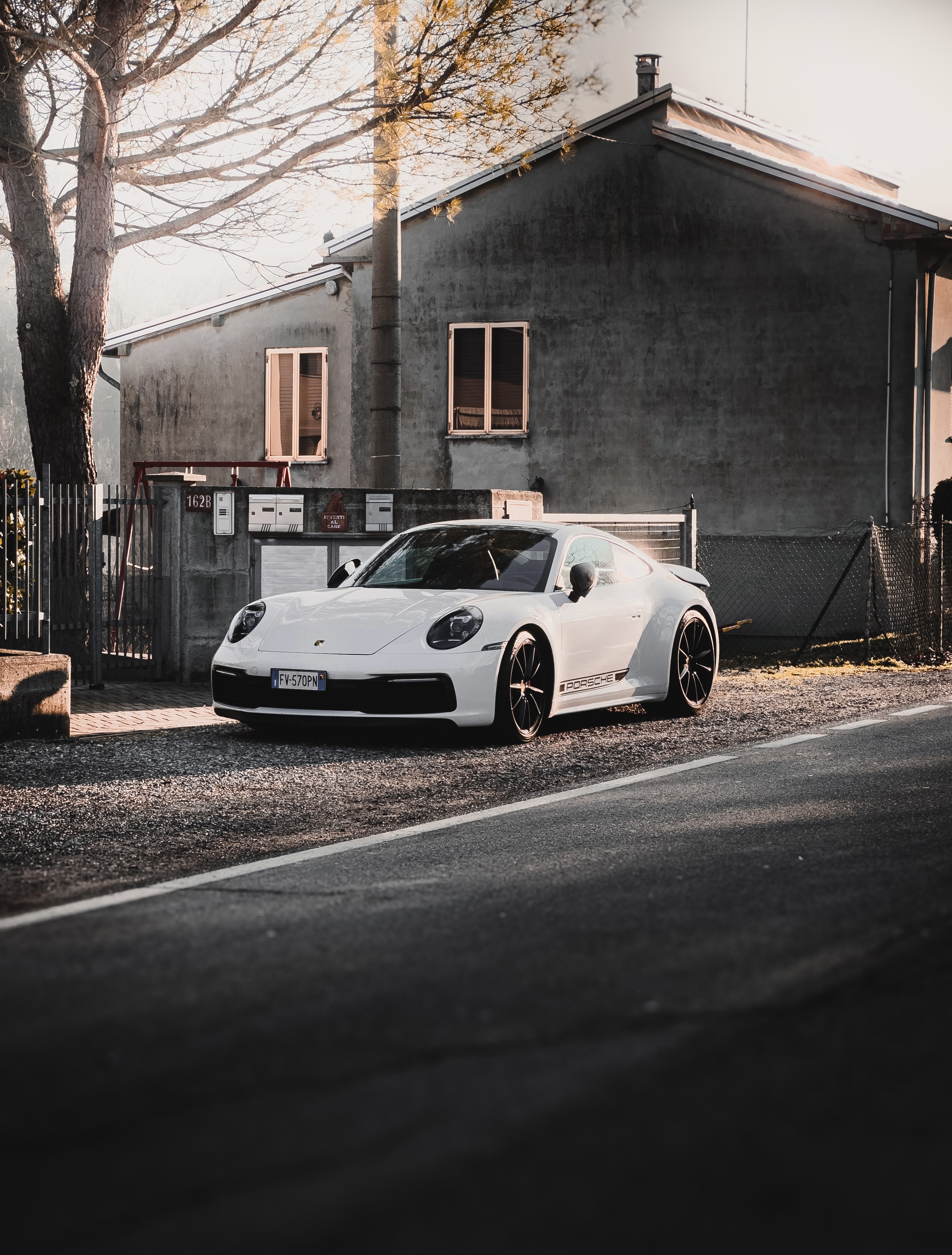 Modern Porsche vs Old Fiat. Shot