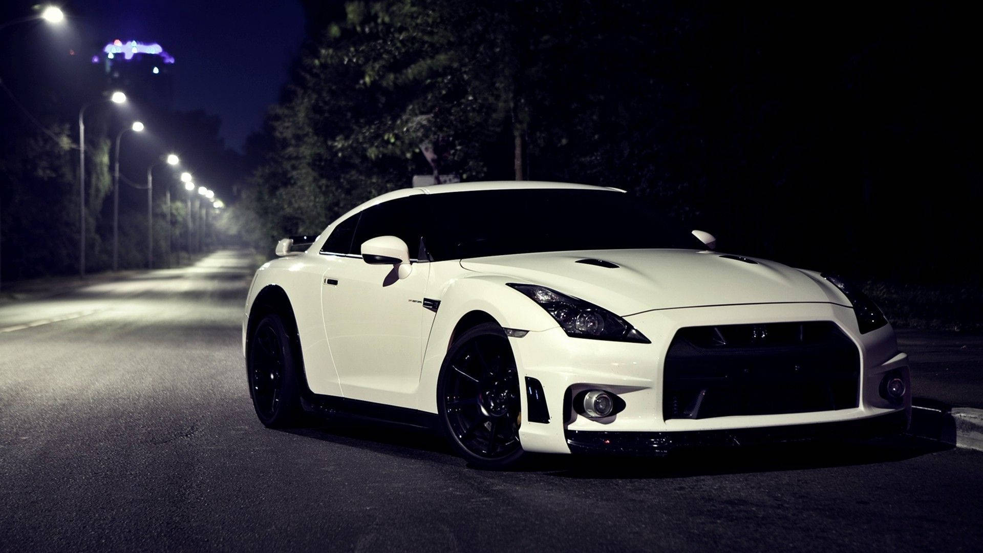 Download White Nissan GTR Car On A Dark