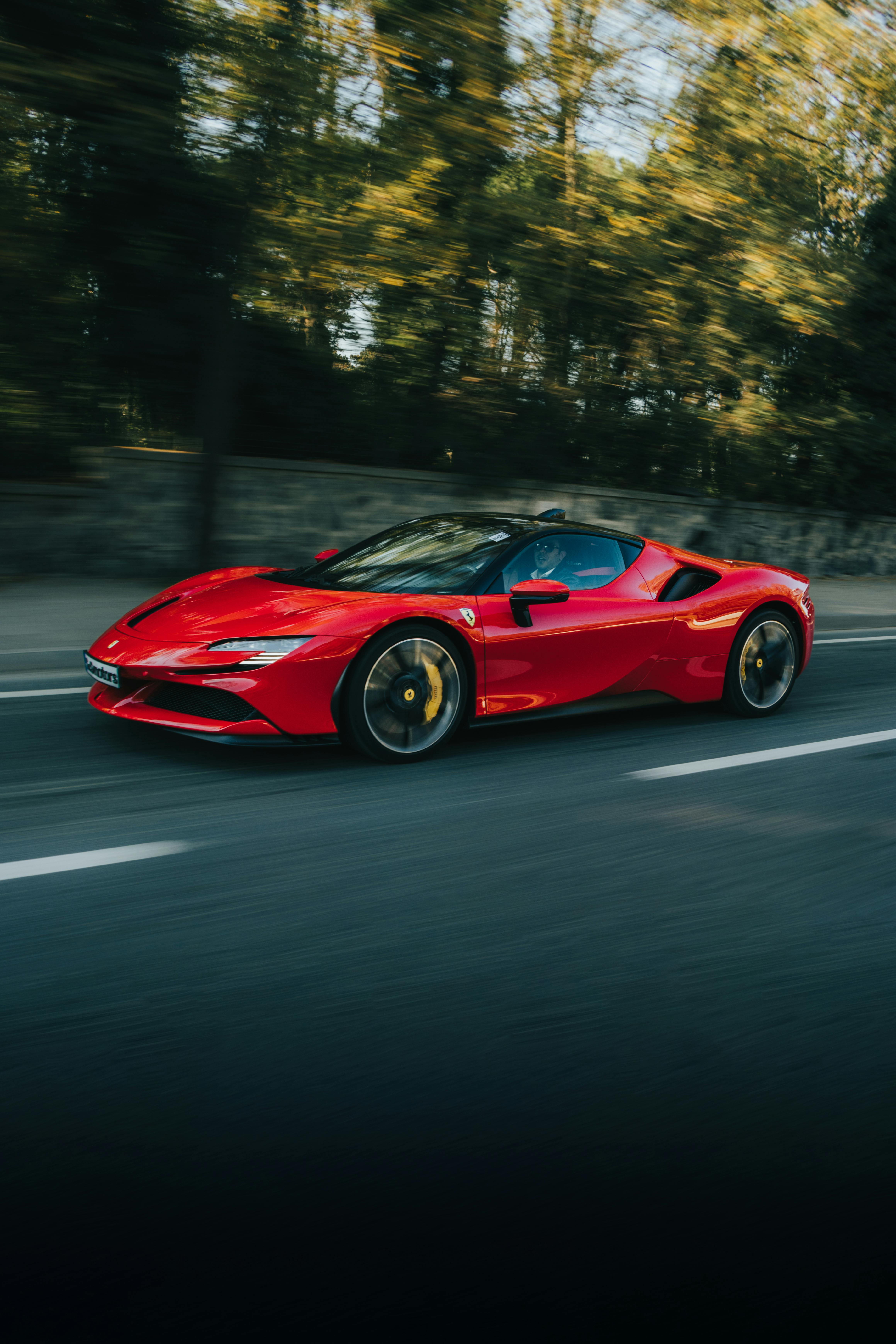 Red Ferrari on the Road · Free