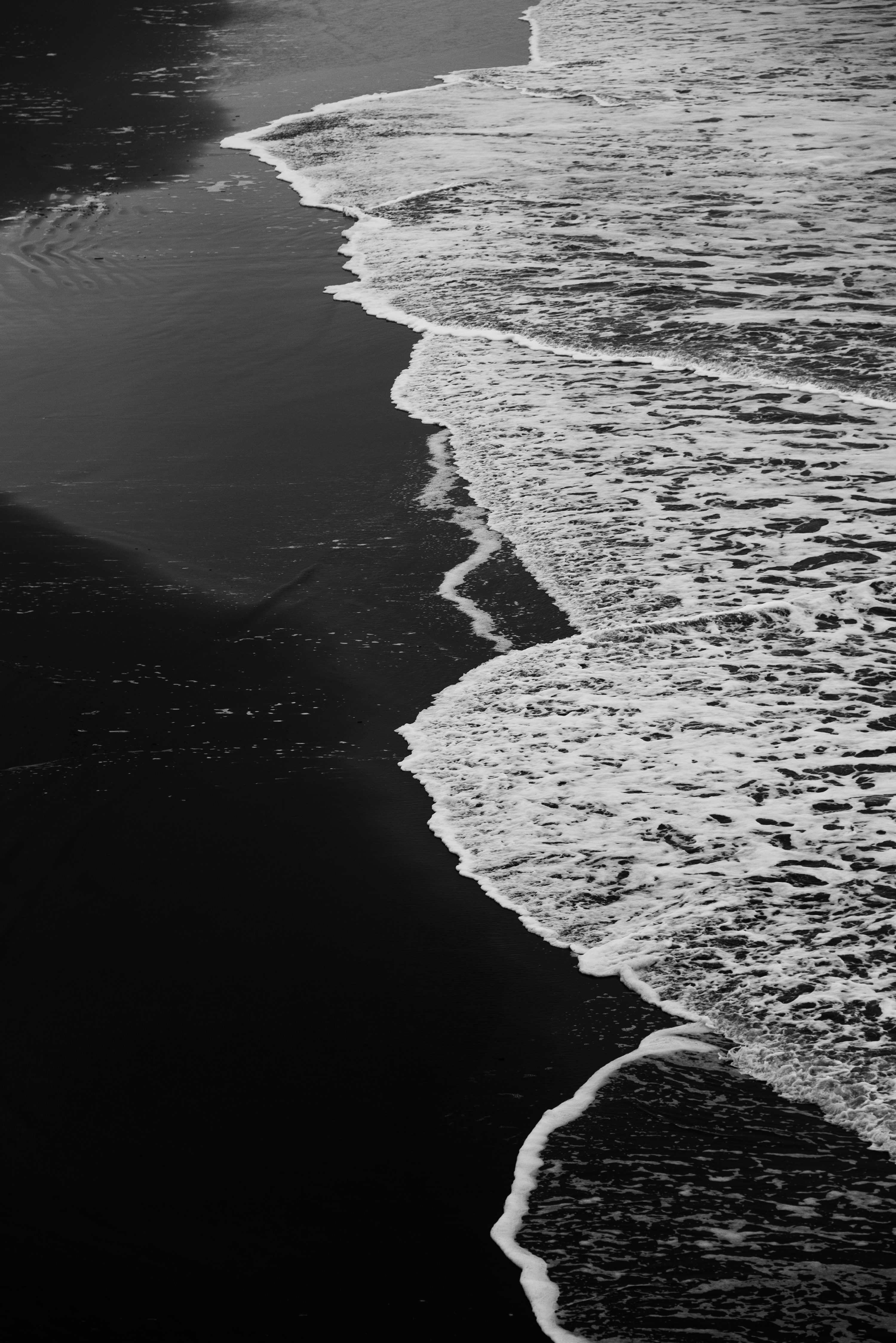Grayscale photo of ocean waves photo