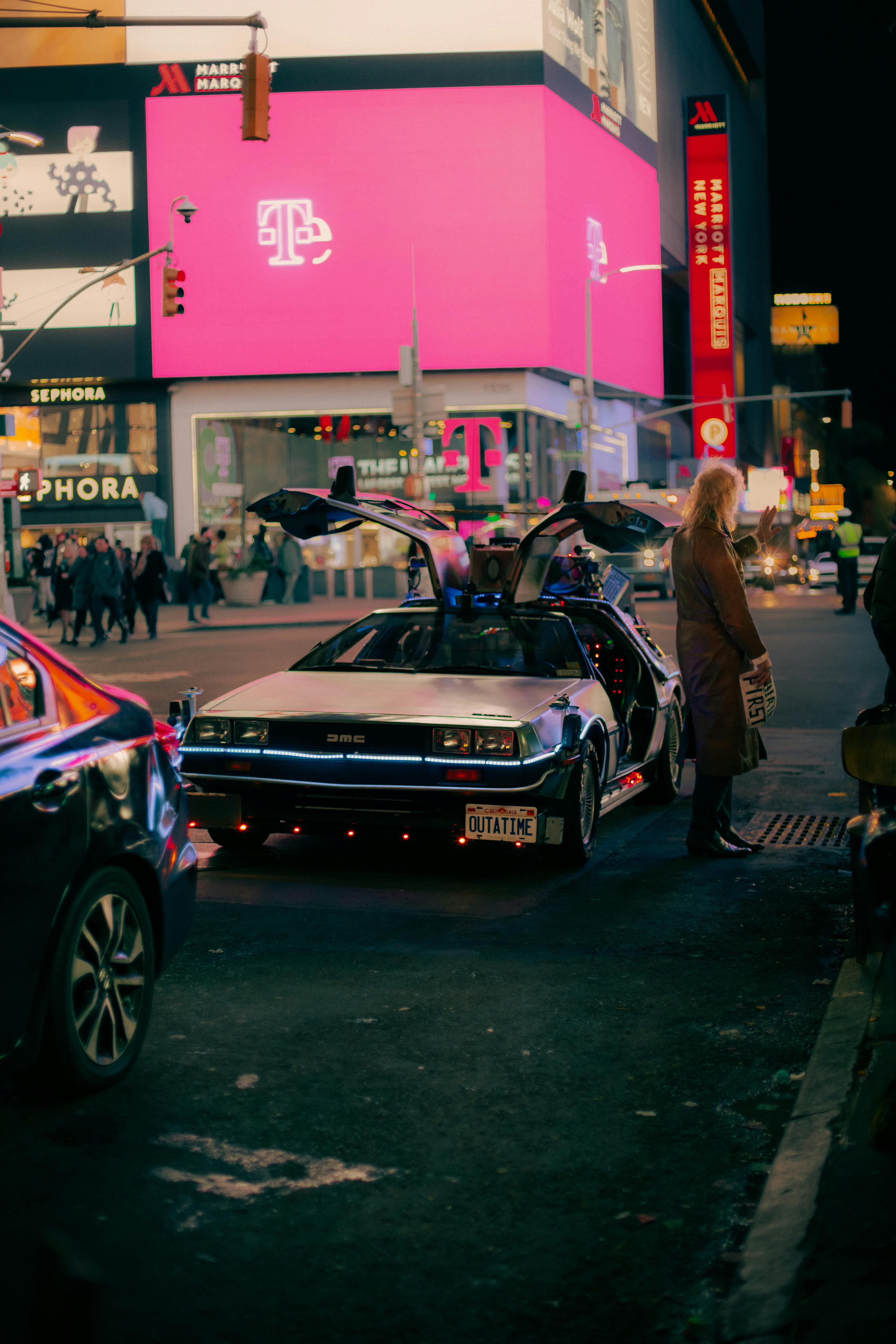DeLorean DMC on Street at Night · Free
