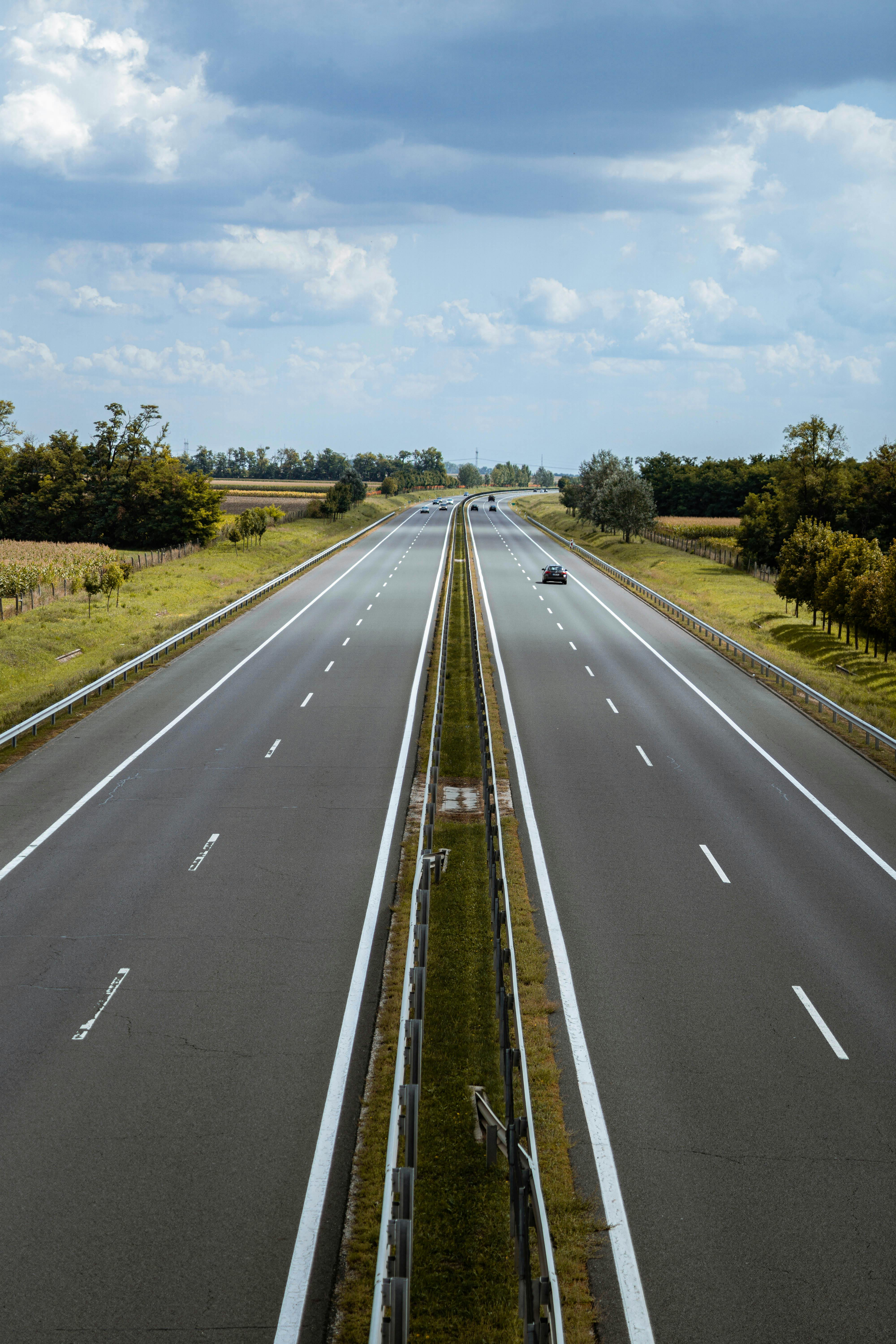 Photo of Expressway Under Cloudy Sky