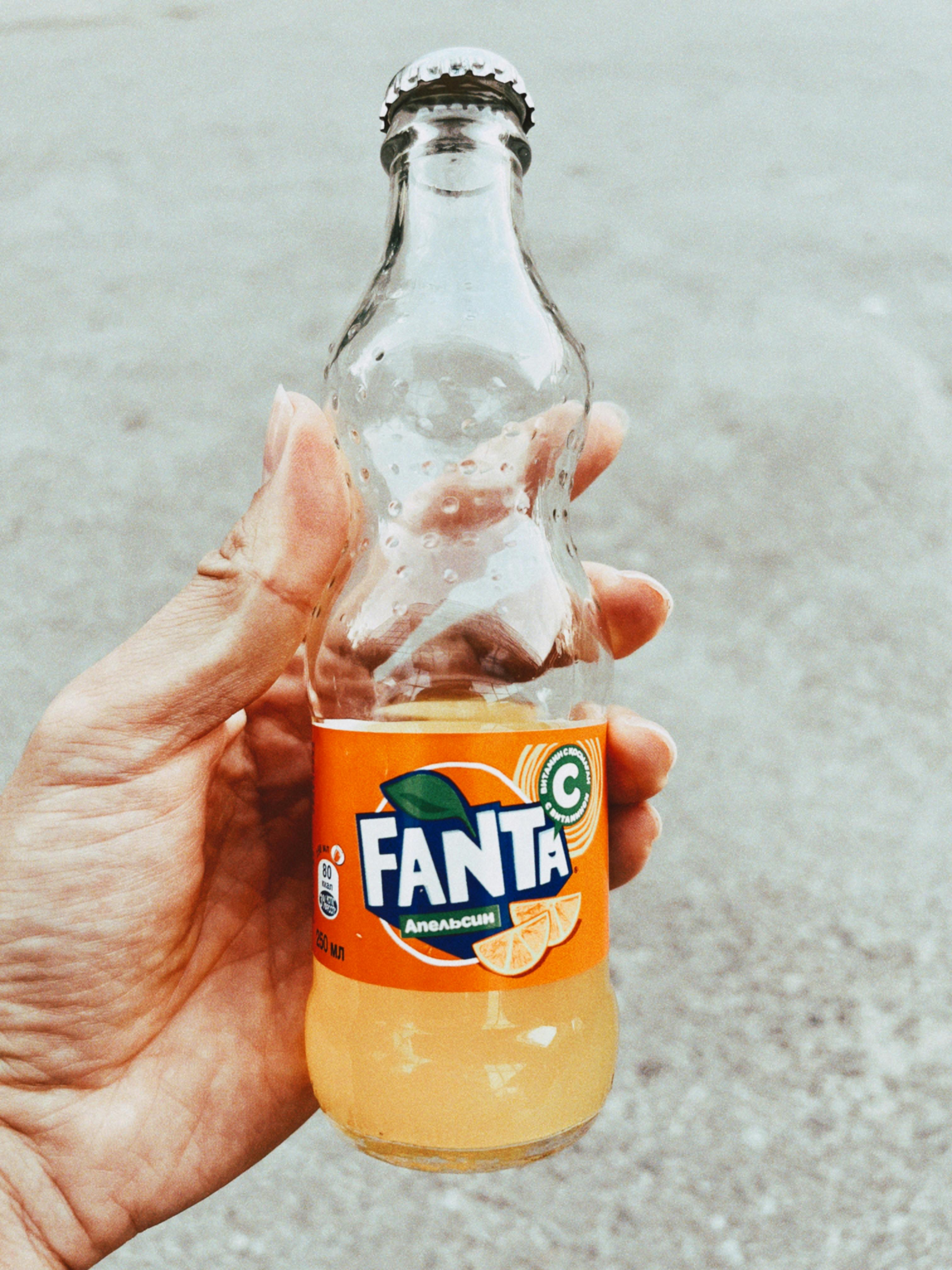 Hand Holding Fanta Bottle · Free Stock