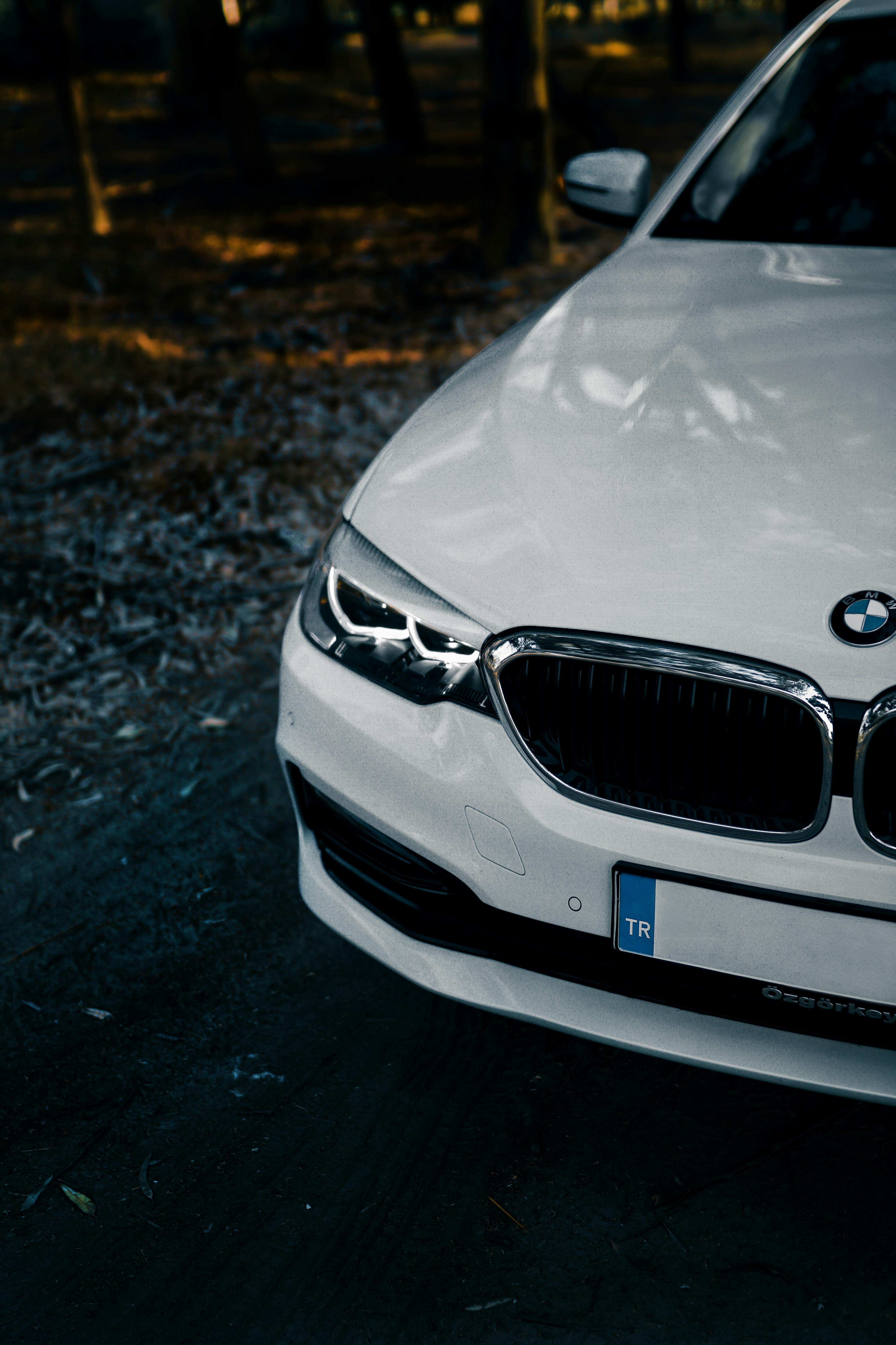 A Headlight of a White BMW Car · Free