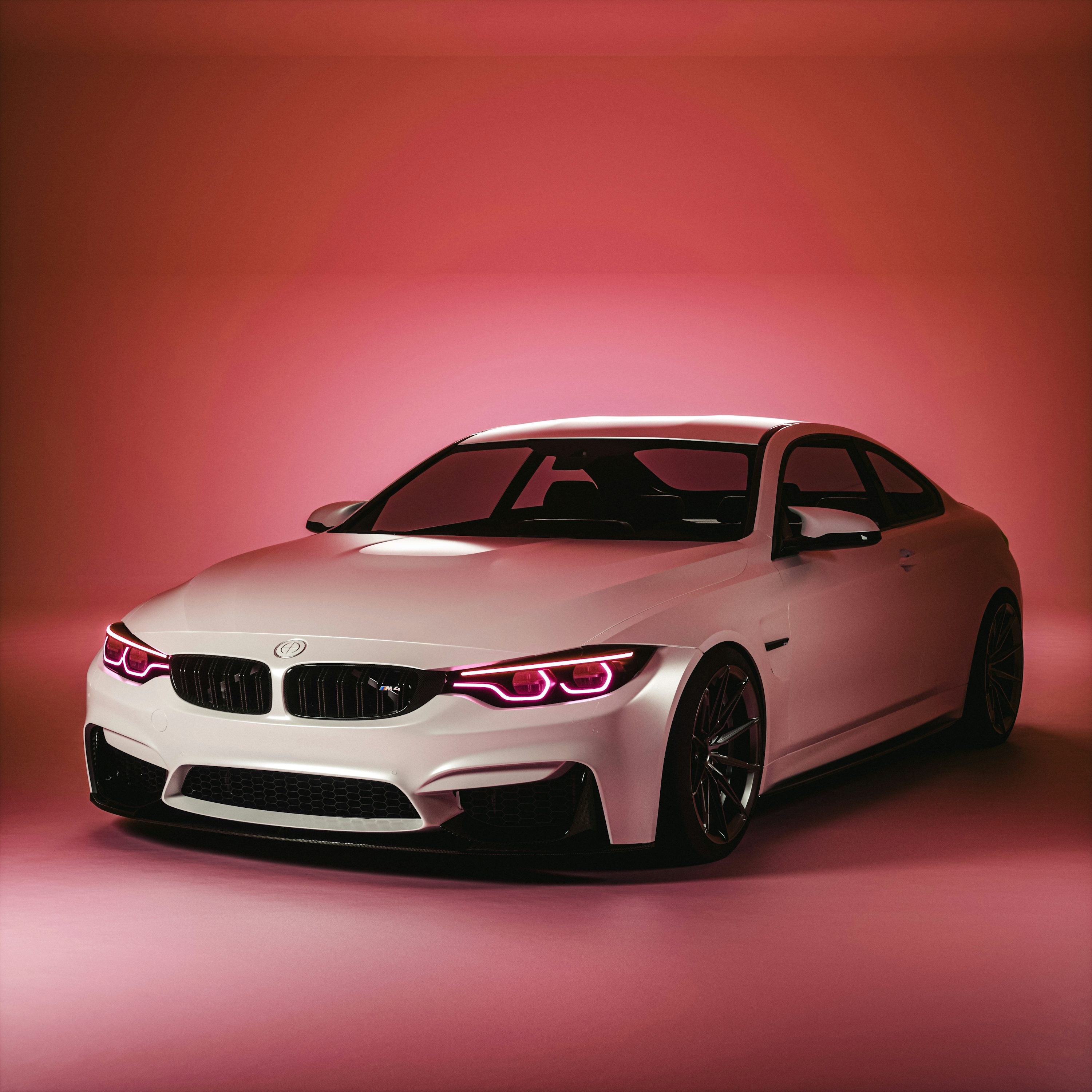 A white car with a red light behind it