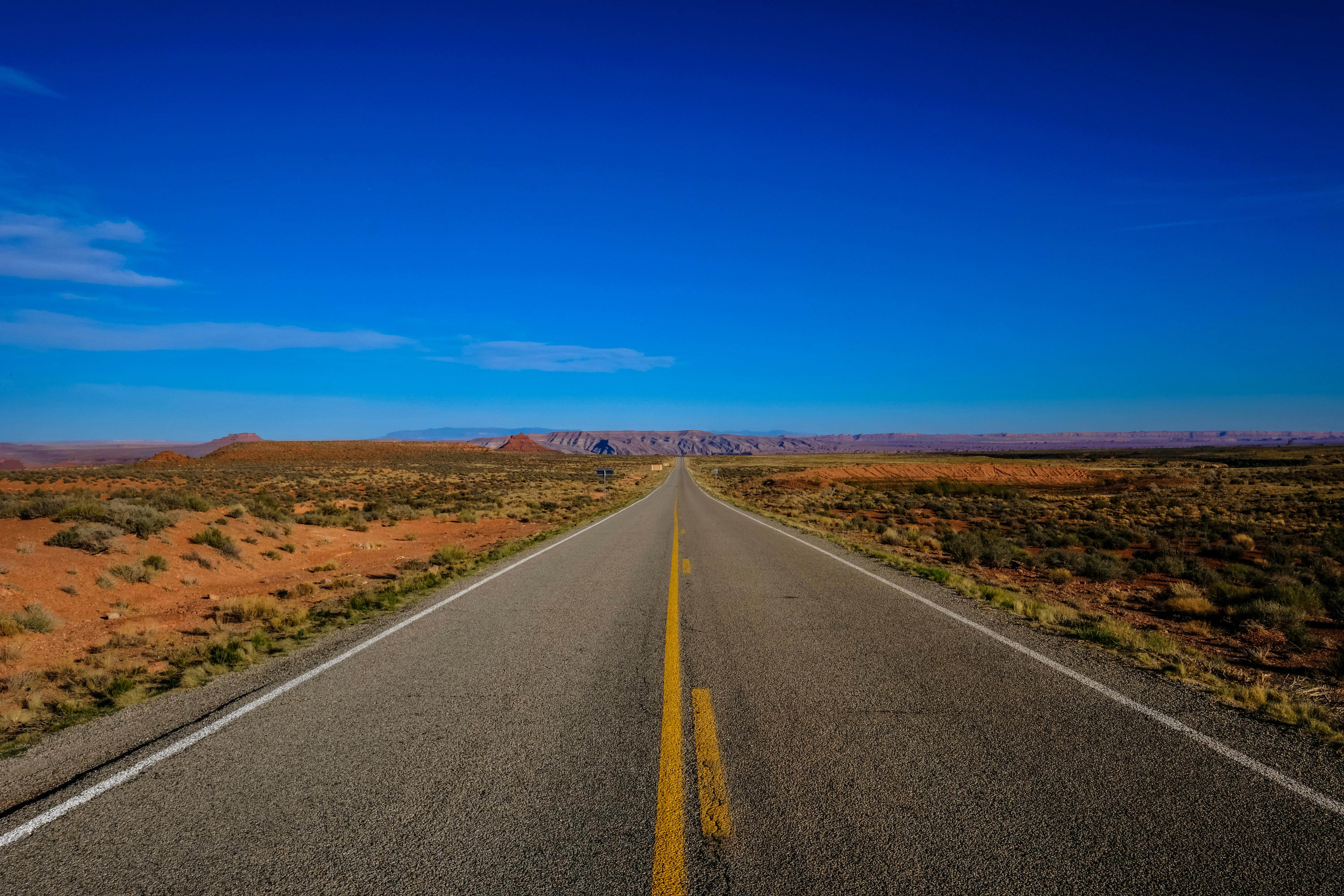 Asphalt Road Under Cloudy Sky · Free