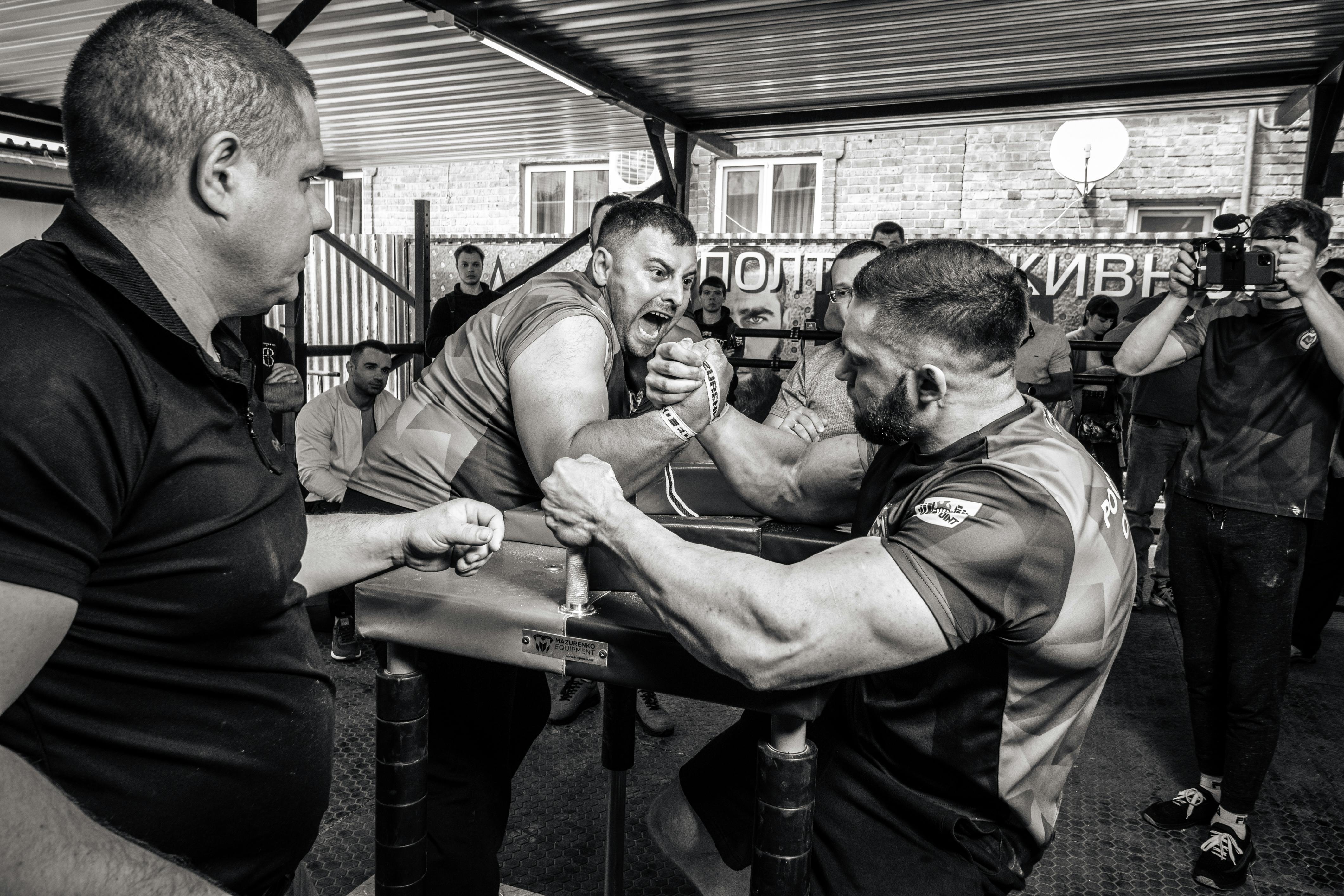 Men Fighting in Arm Wrestling · Free
