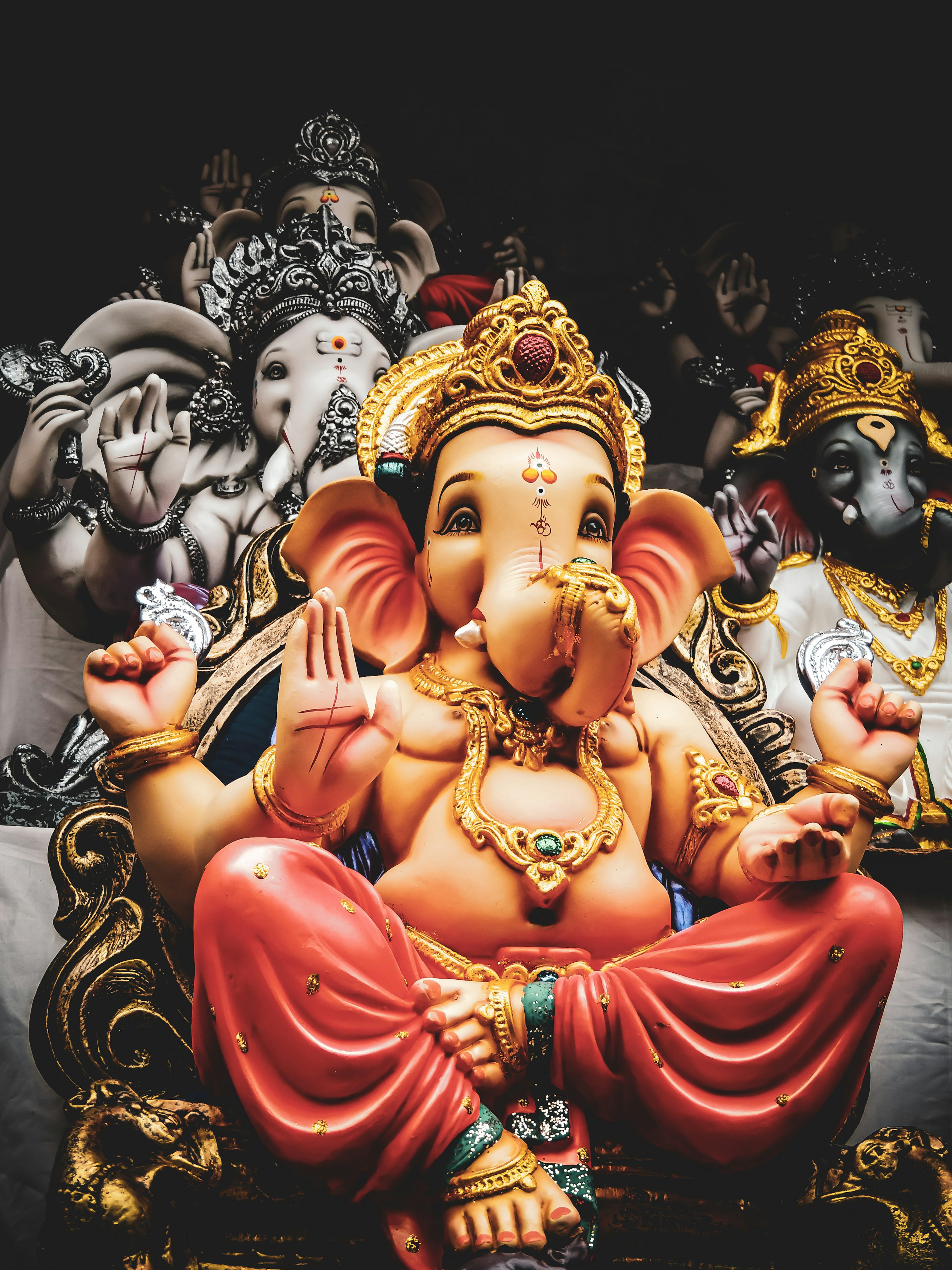 Three Lord Ganesha statuettes photo