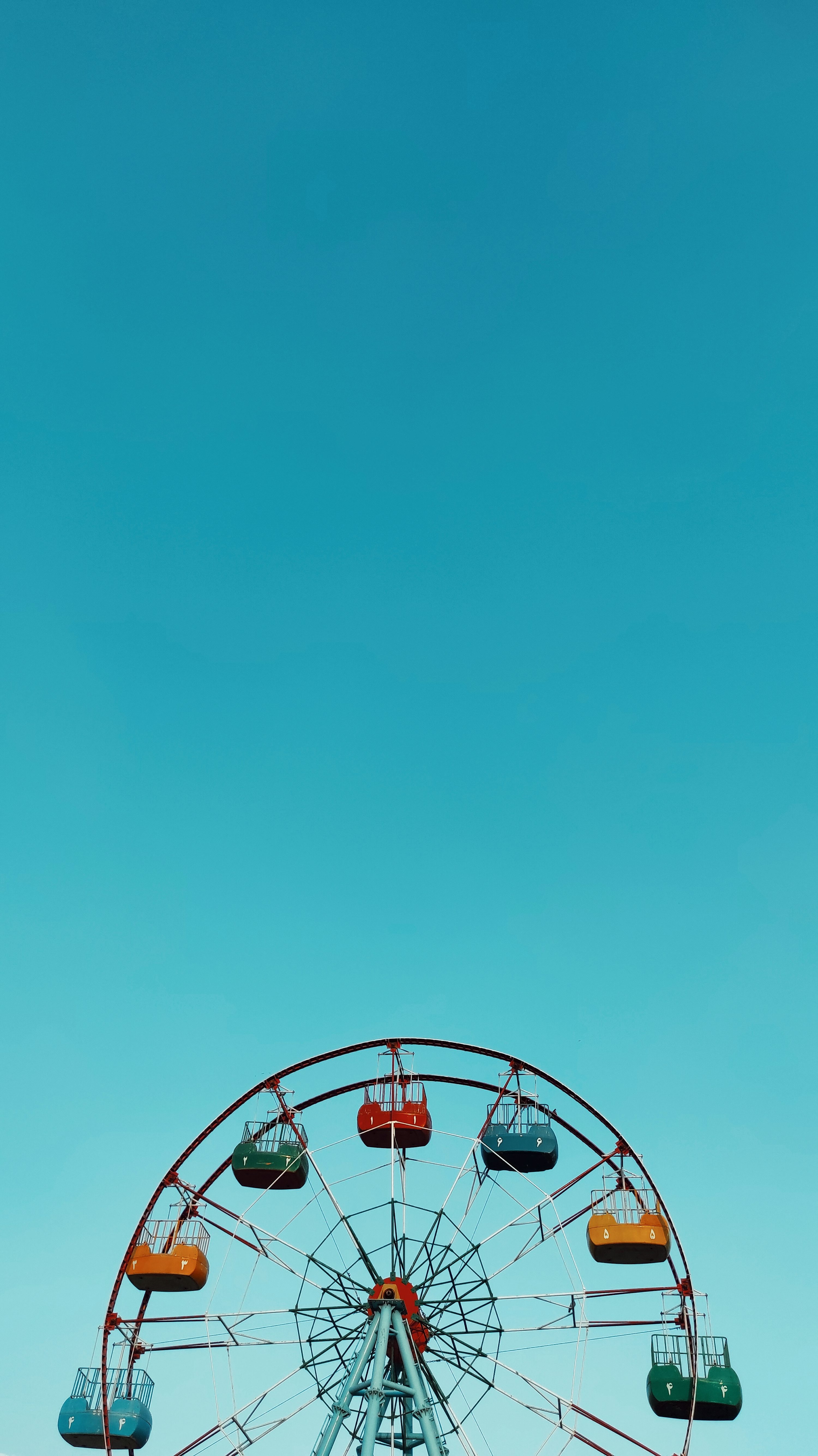 white ferris wheel under blue sky