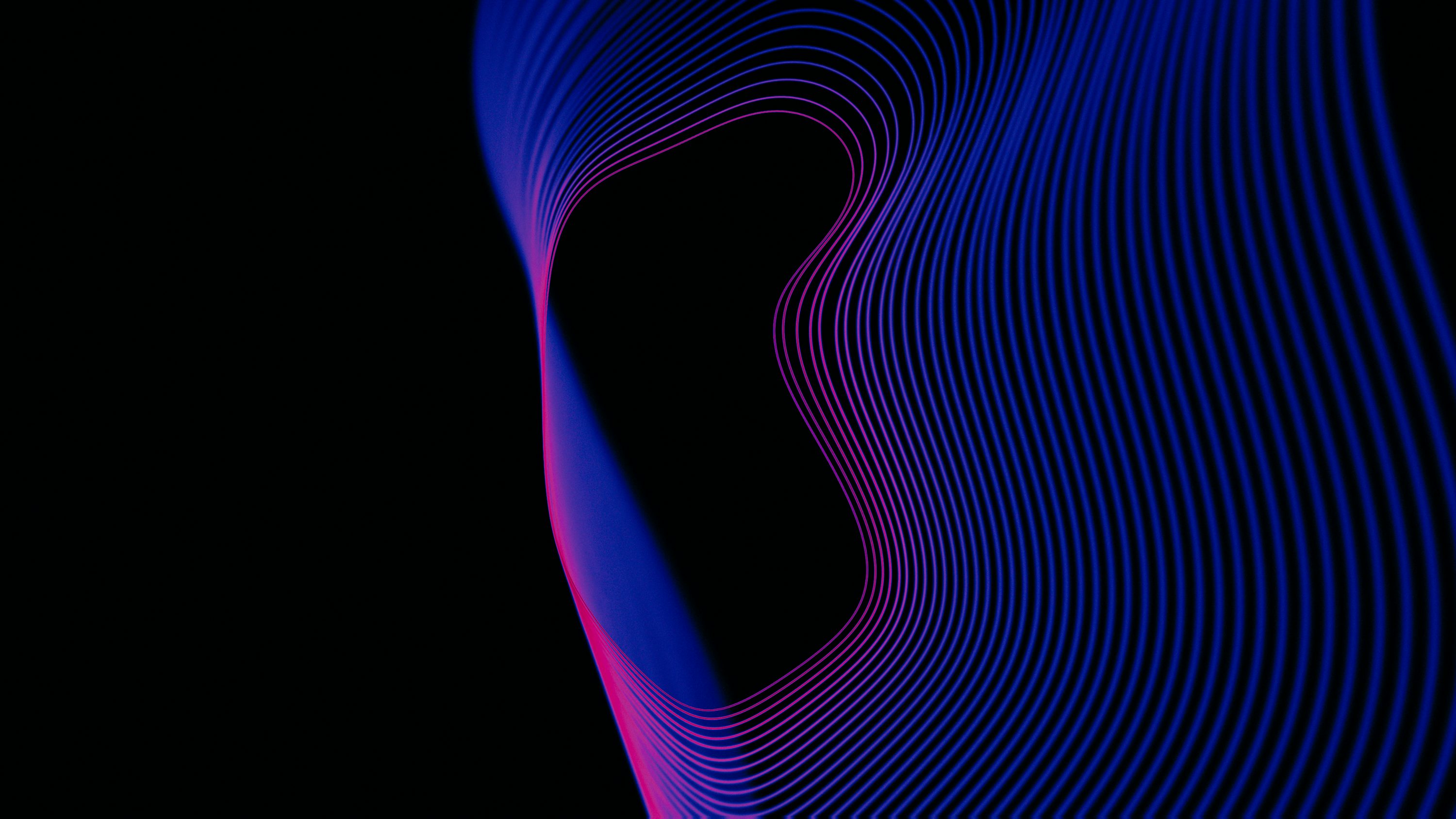 A black background with blue and pink