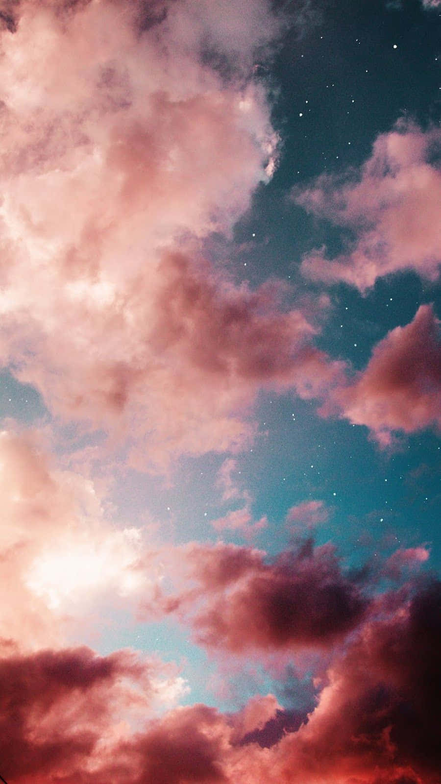 Pink Clouds Background With Stars