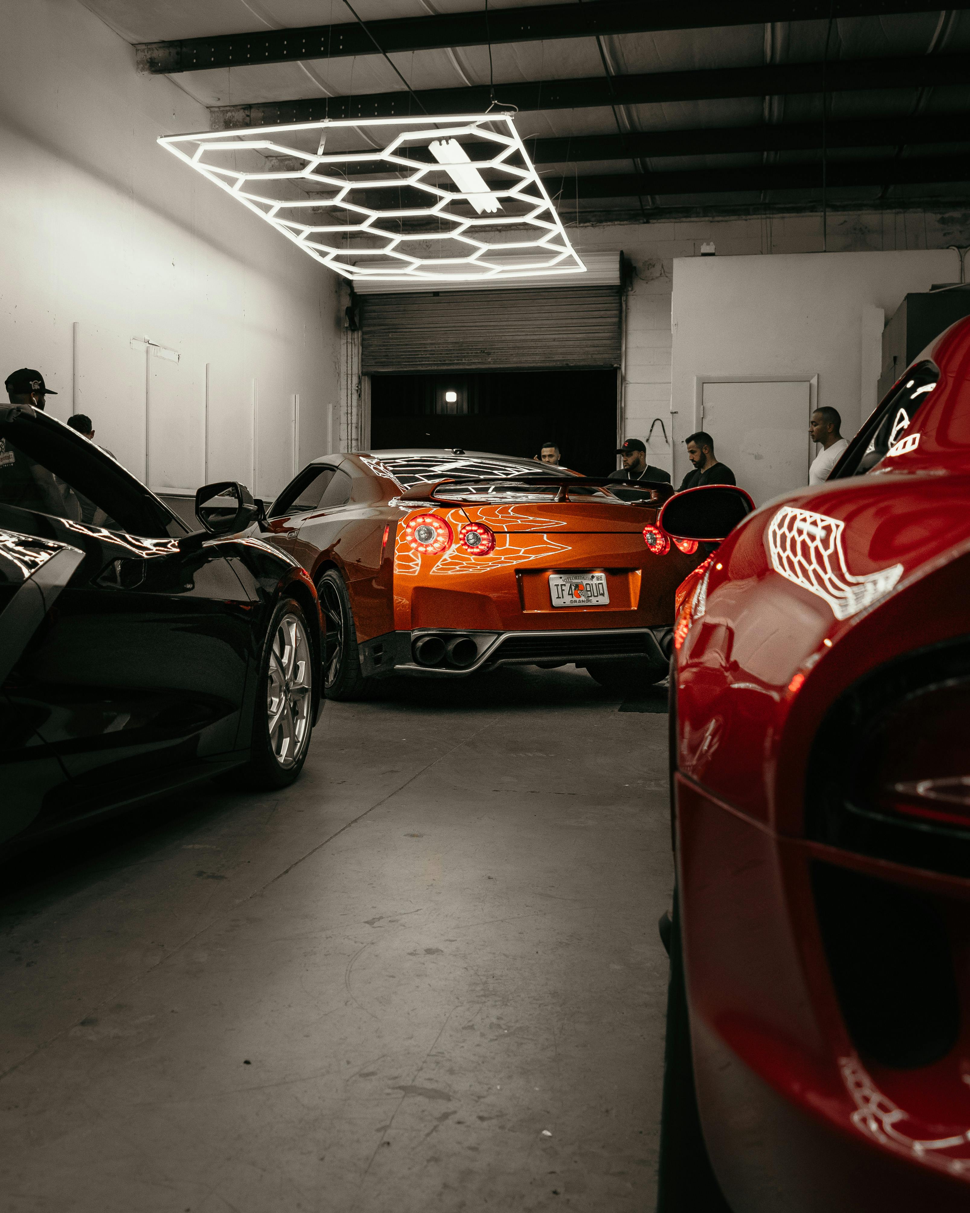 Luxury Cars inside a Garage · Free