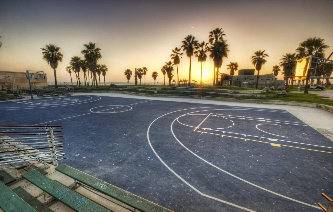 Sunset Over an Empty Basketball Court