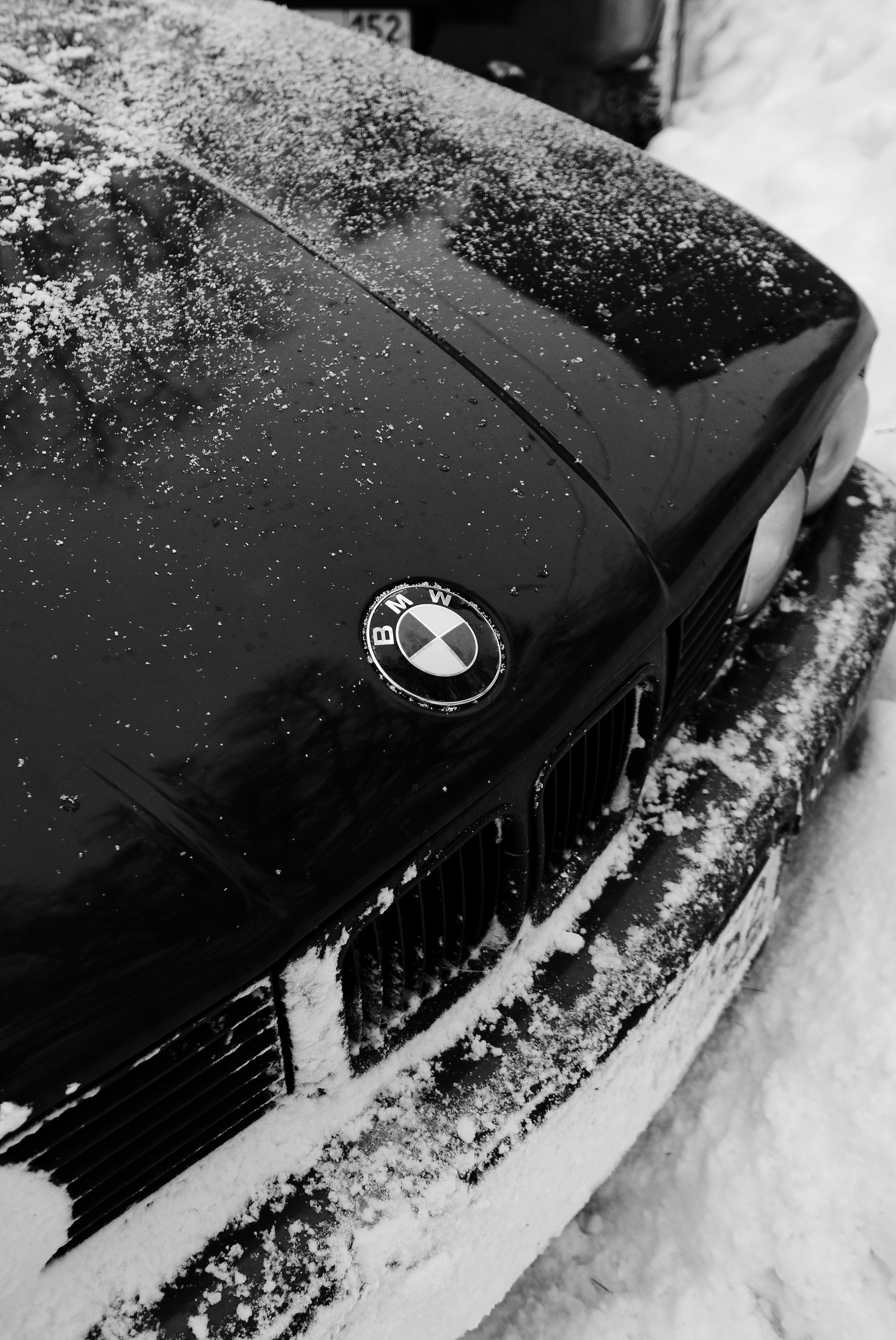Black Bmw Car on Snow Covered Ground