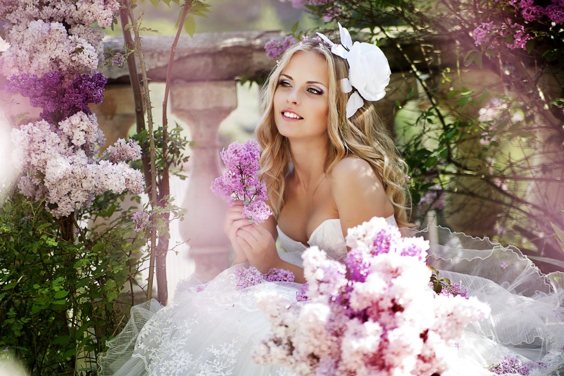 White Wedding Dress Holding Bouquet