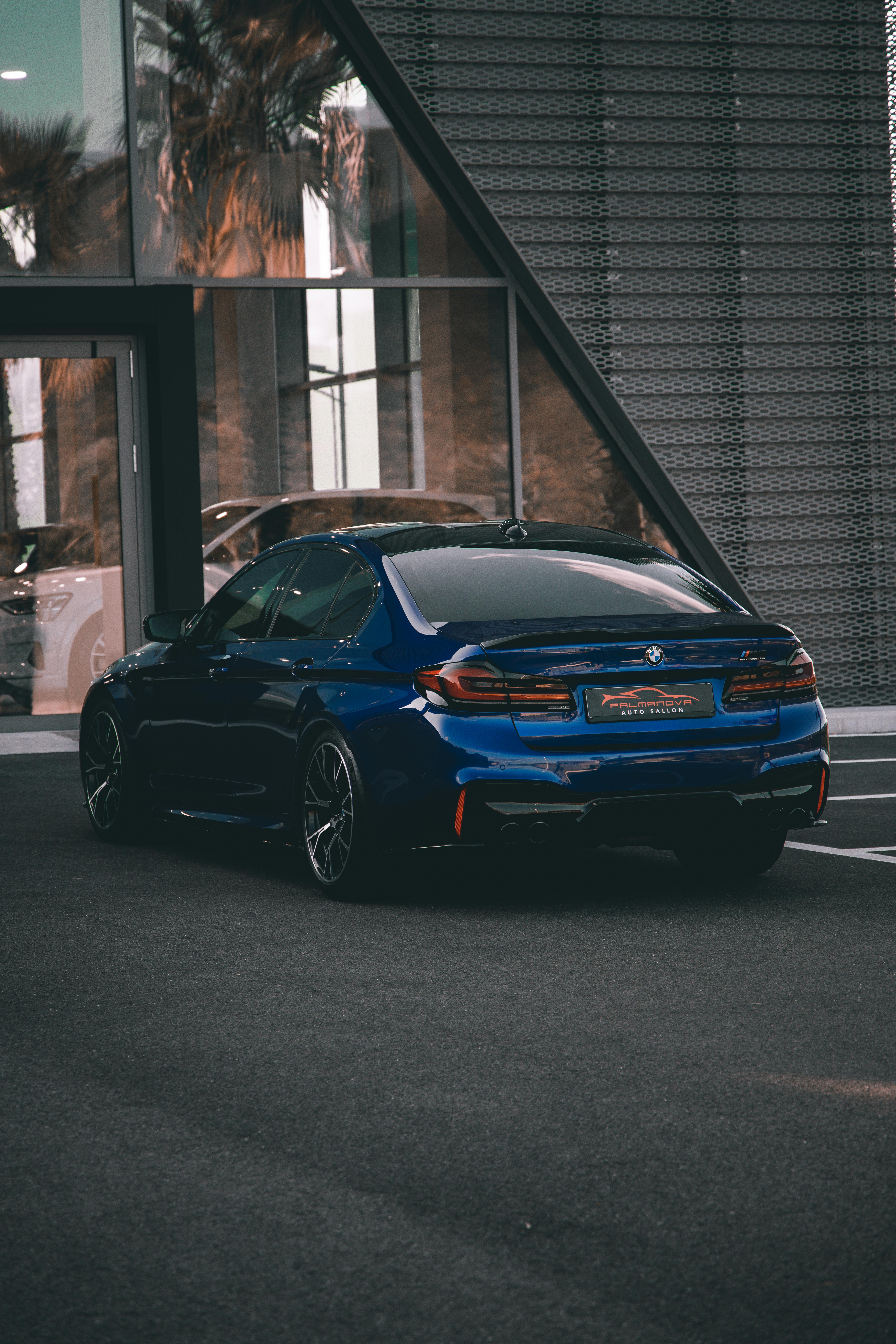 View of a Blue BMW M5 Parked in Front