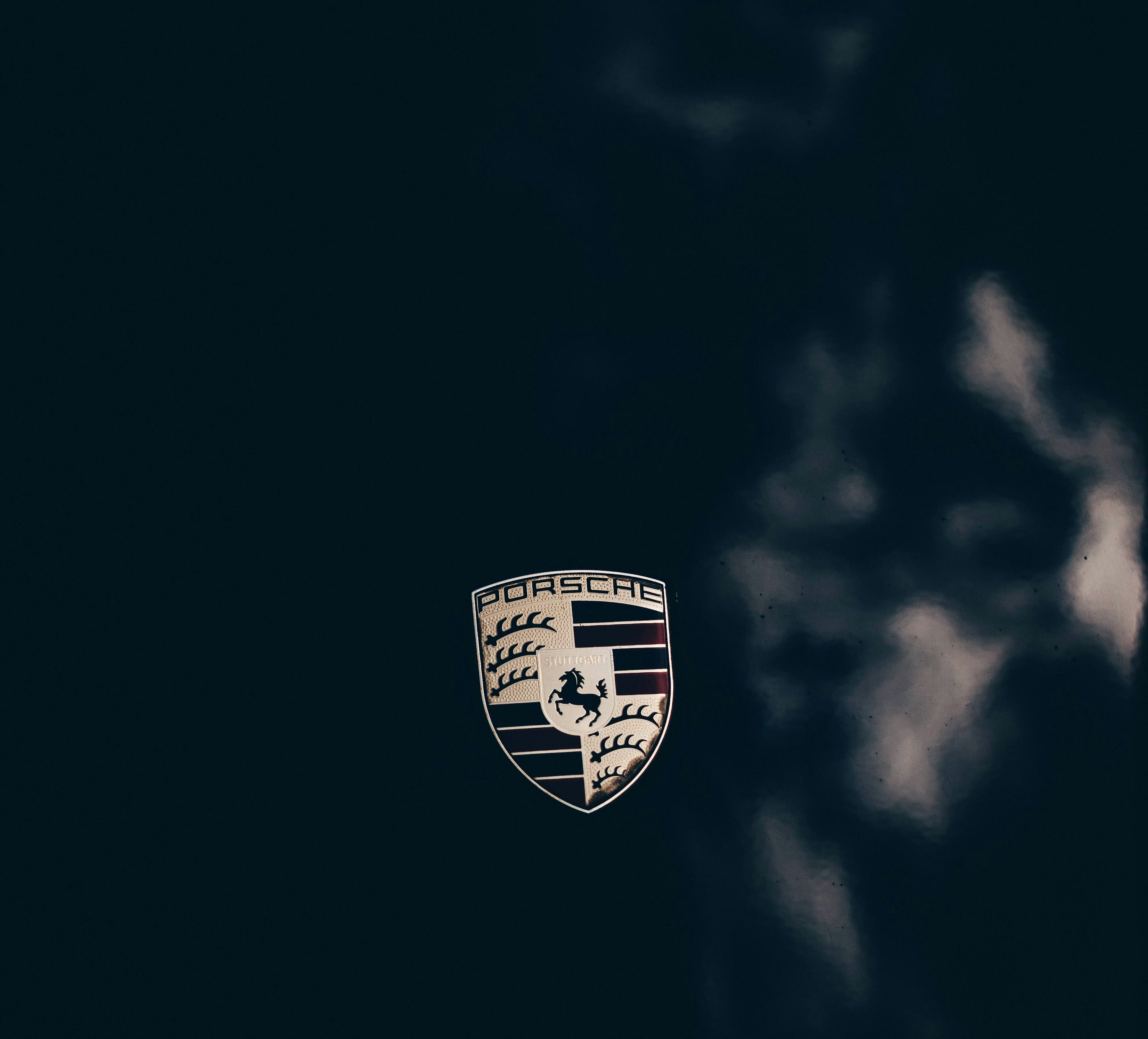 A porsche emblem on a black background