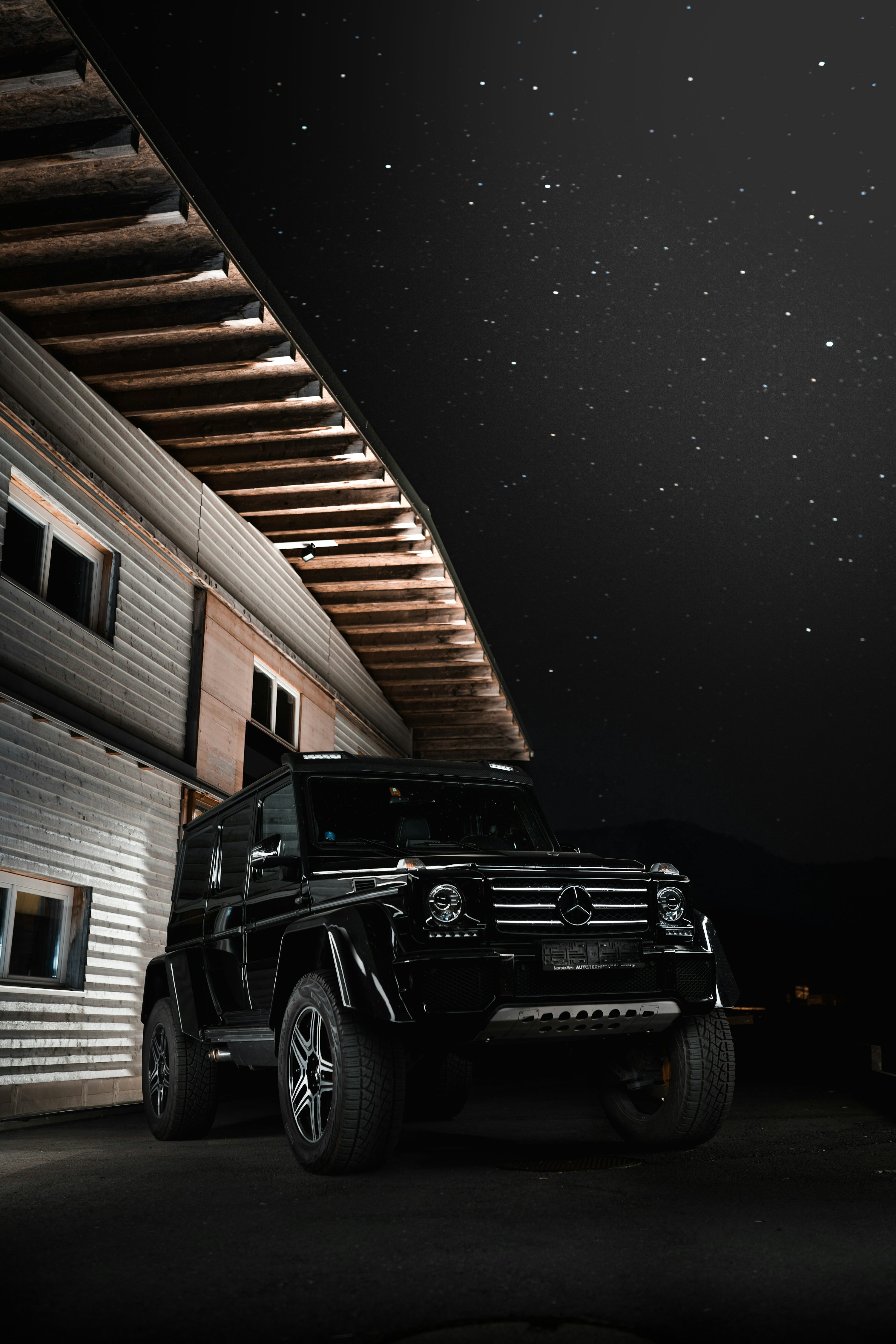 Black jeep wrangler parked near brown